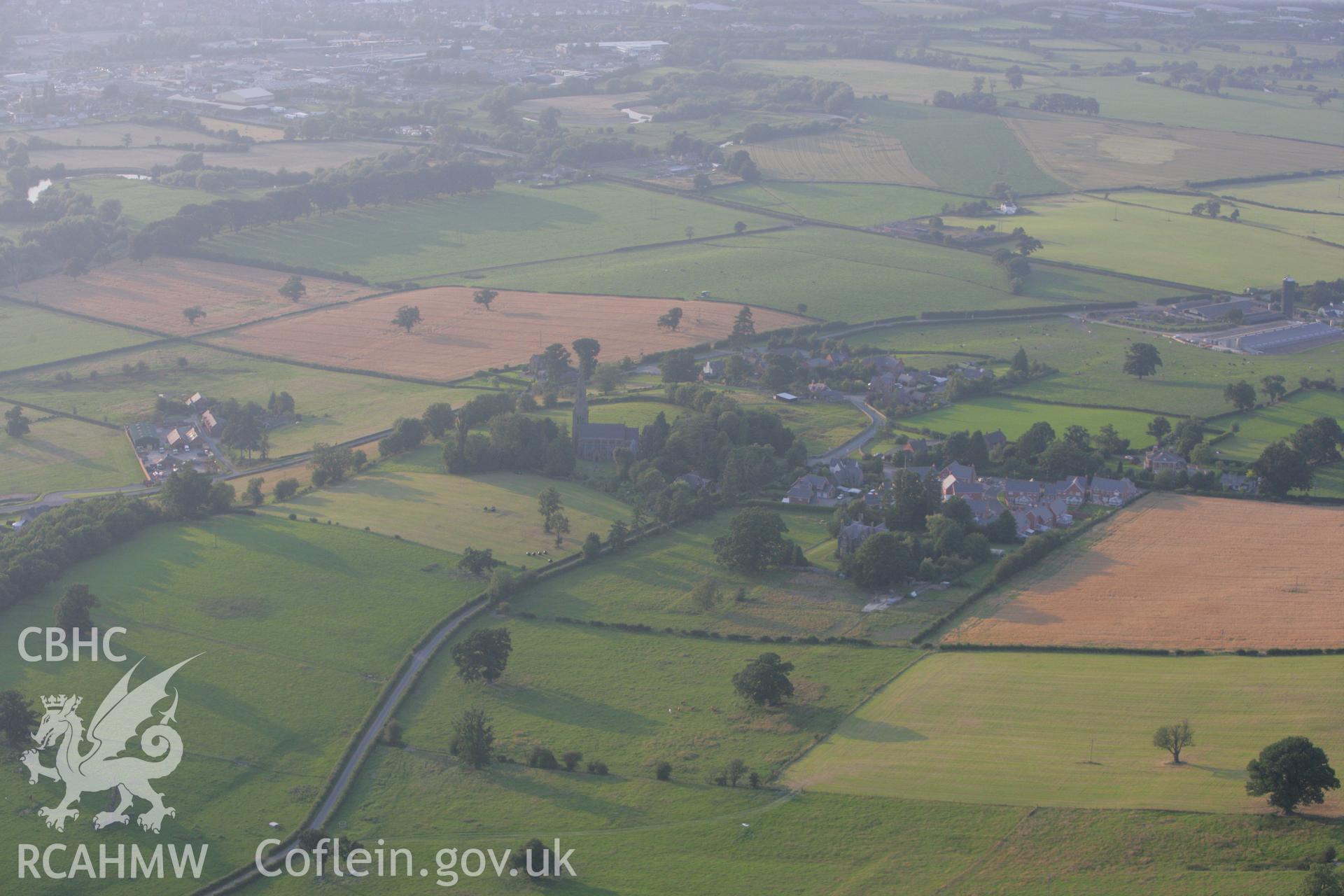 RCAHMW colour oblique photograph of Leighton village, with Holy Trinity Church. Taken by Toby Driver on 24/07/2008.