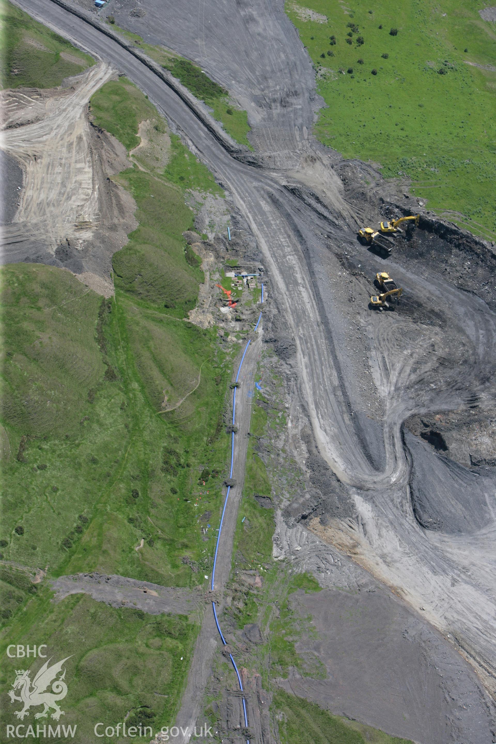 RCAHMW colour oblique photograph of lorries at Ffos-y-fran Dowlais Opencast workings. Taken by Toby Driver on 09/06/2008.