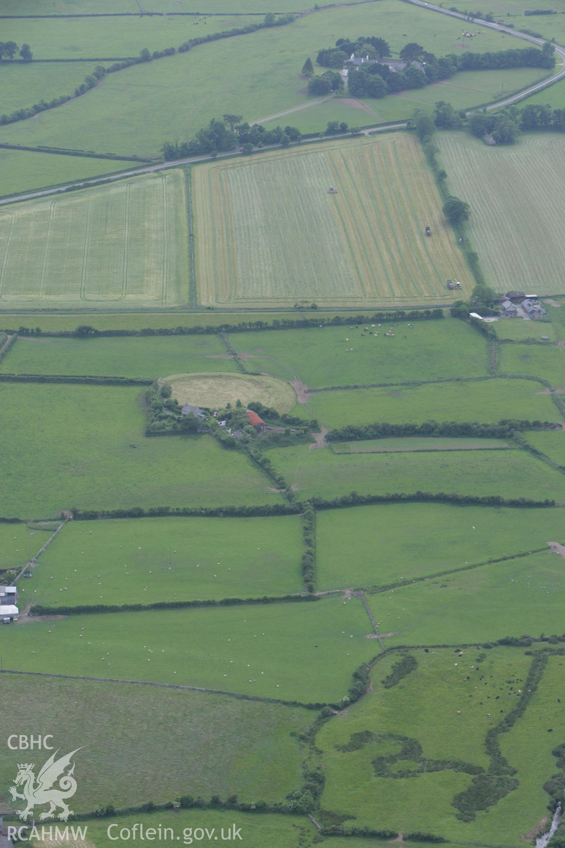 RCAHMW colour oblique photograph of Castell Bryn Gwyn, Neolithic henge and later ringwork. Taken by Toby Driver on 13/06/2008.