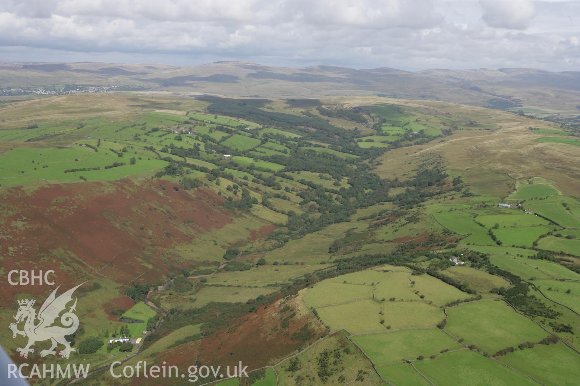 RCAHMW colour oblique photograph of landscape looking north down River Egel valley, with Allt-y-Cadno farmstead, now in ruins. Taken by Toby Driver on 12/09/2008.