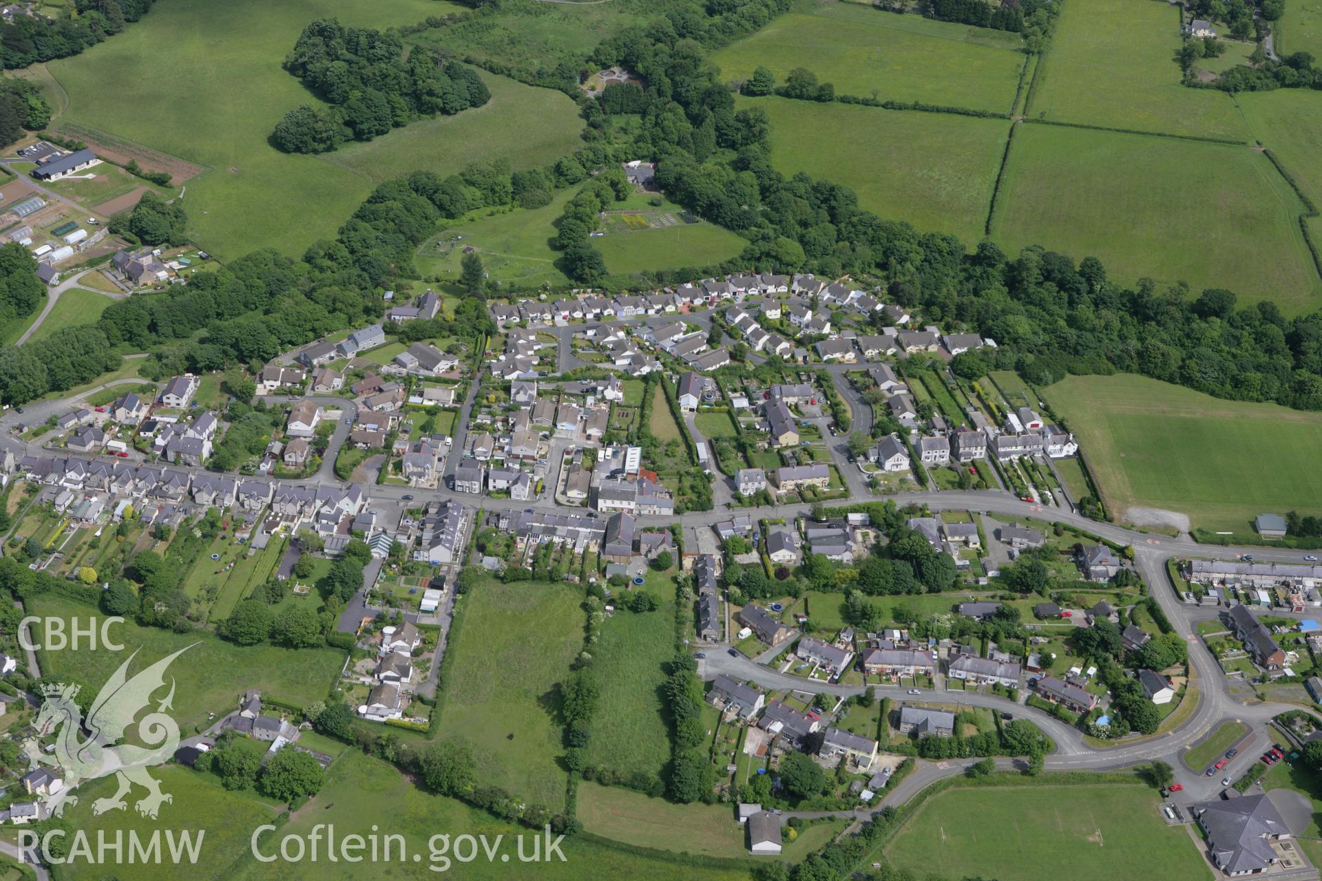 RCAHMW colour oblique photograph of Llangoed village, with Ysgol Gynradd Llangoed. Taken by Toby Driver on 13/06/2008.
