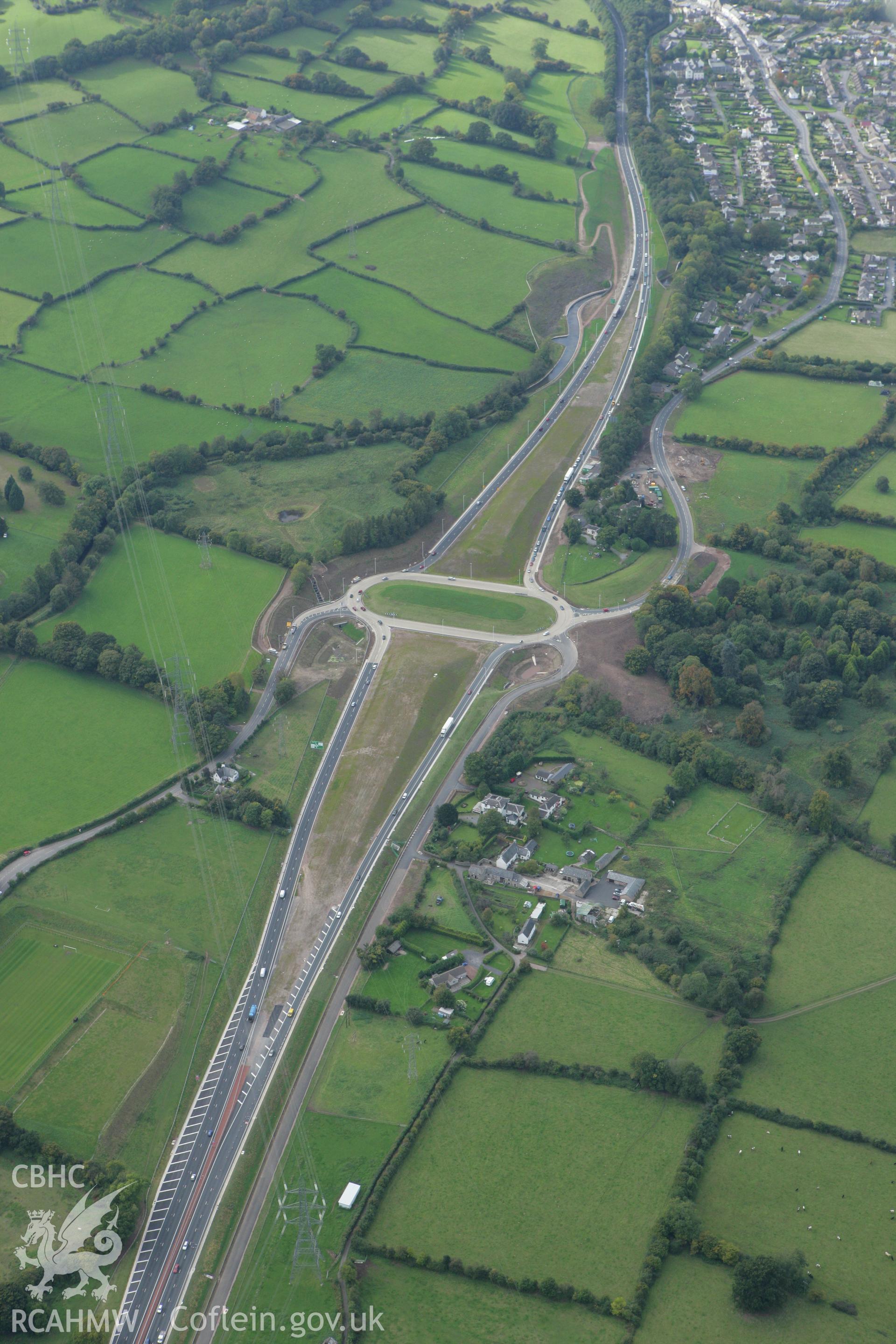 RCAHMW colour oblique photograph of Glan Bidan House, with development of the A465, east of Gilwern. Taken by Toby Driver on 10/10/2008.