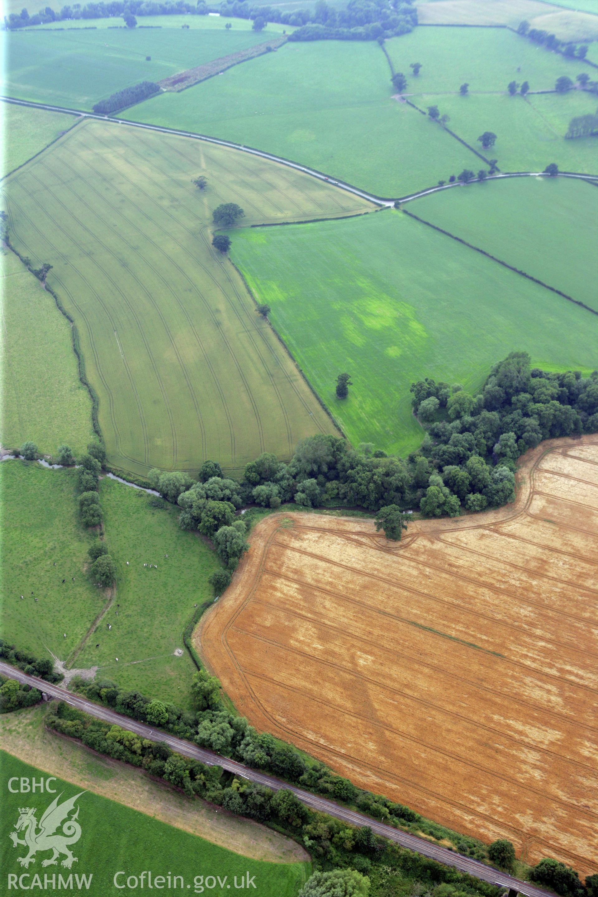 RCAHMW colour oblique photograph of Forden Gaer double-ditched enclosure or 'Tremenos', temple enclosure. Taken by Toby Driver on 24/07/2008.