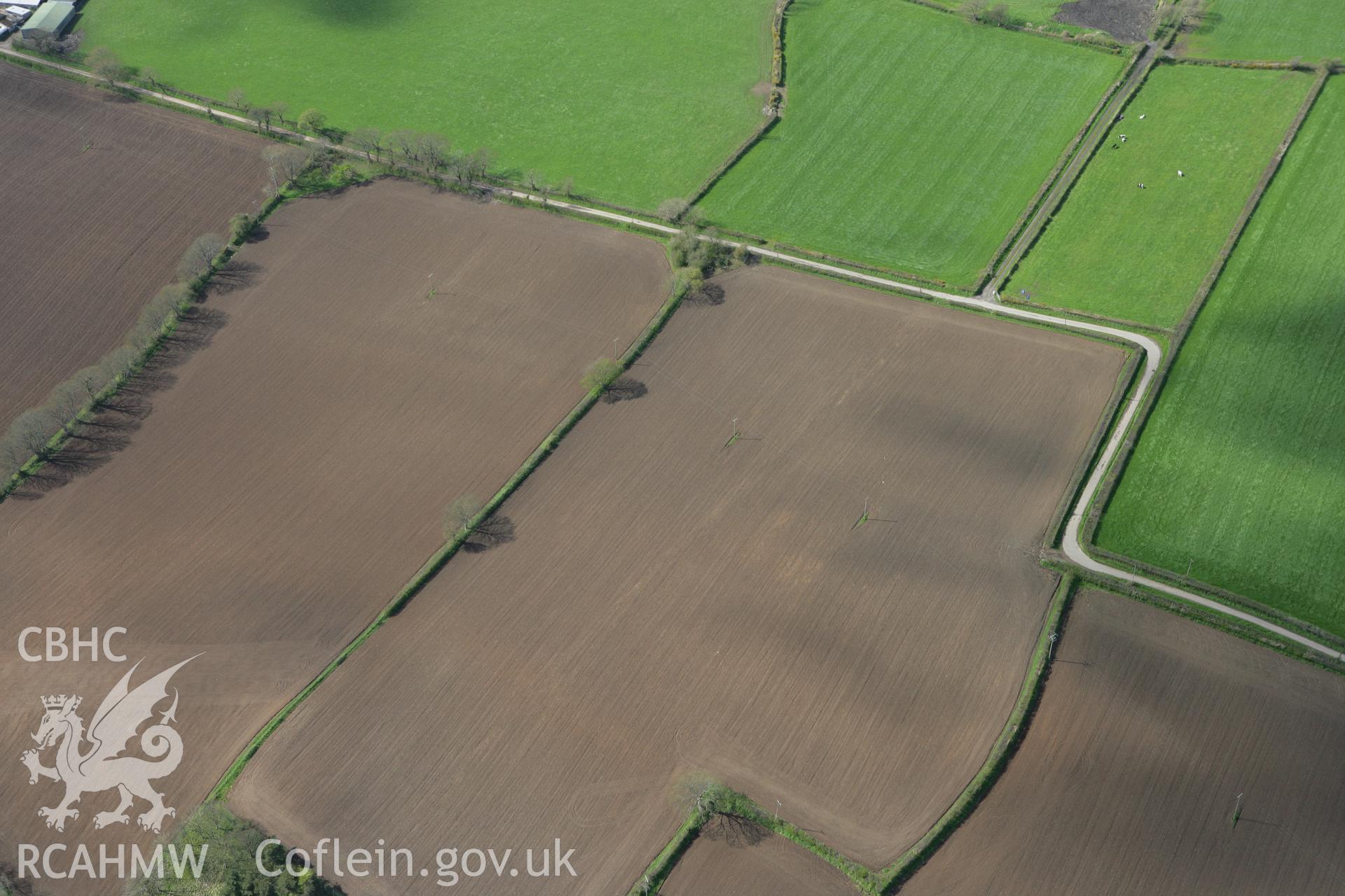 RCAHMW colour oblique photograph of non-archaeological soilmarks, Old Castle Farm, Cardigan. Taken by Toby Driver on 24/04/2008.