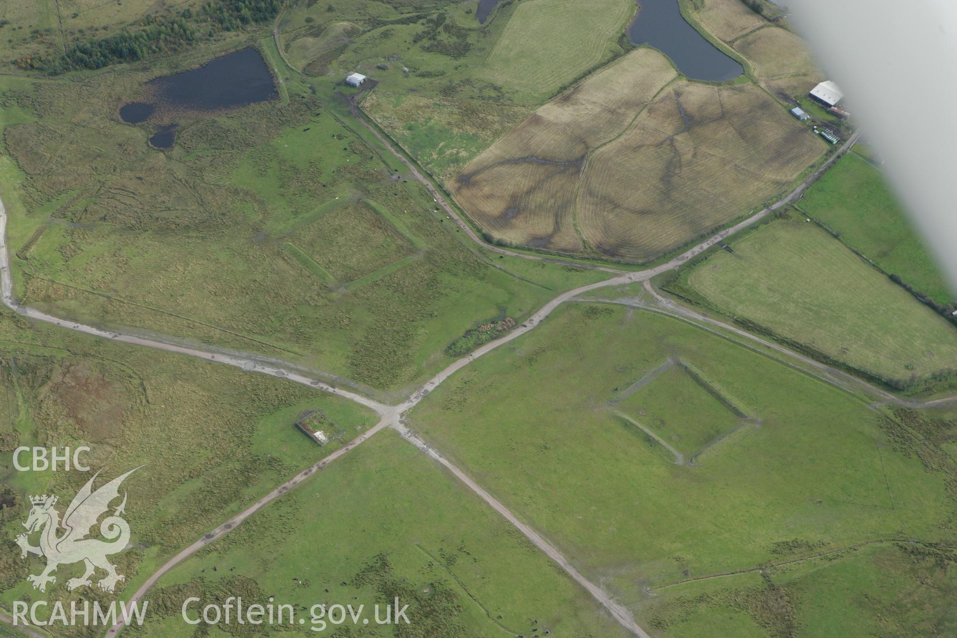 RCAHMW colour oblique photograph of earthwork tanks, part of the Clydach Terrace Mine Workings. Taken by Toby Driver on 10/10/2008.