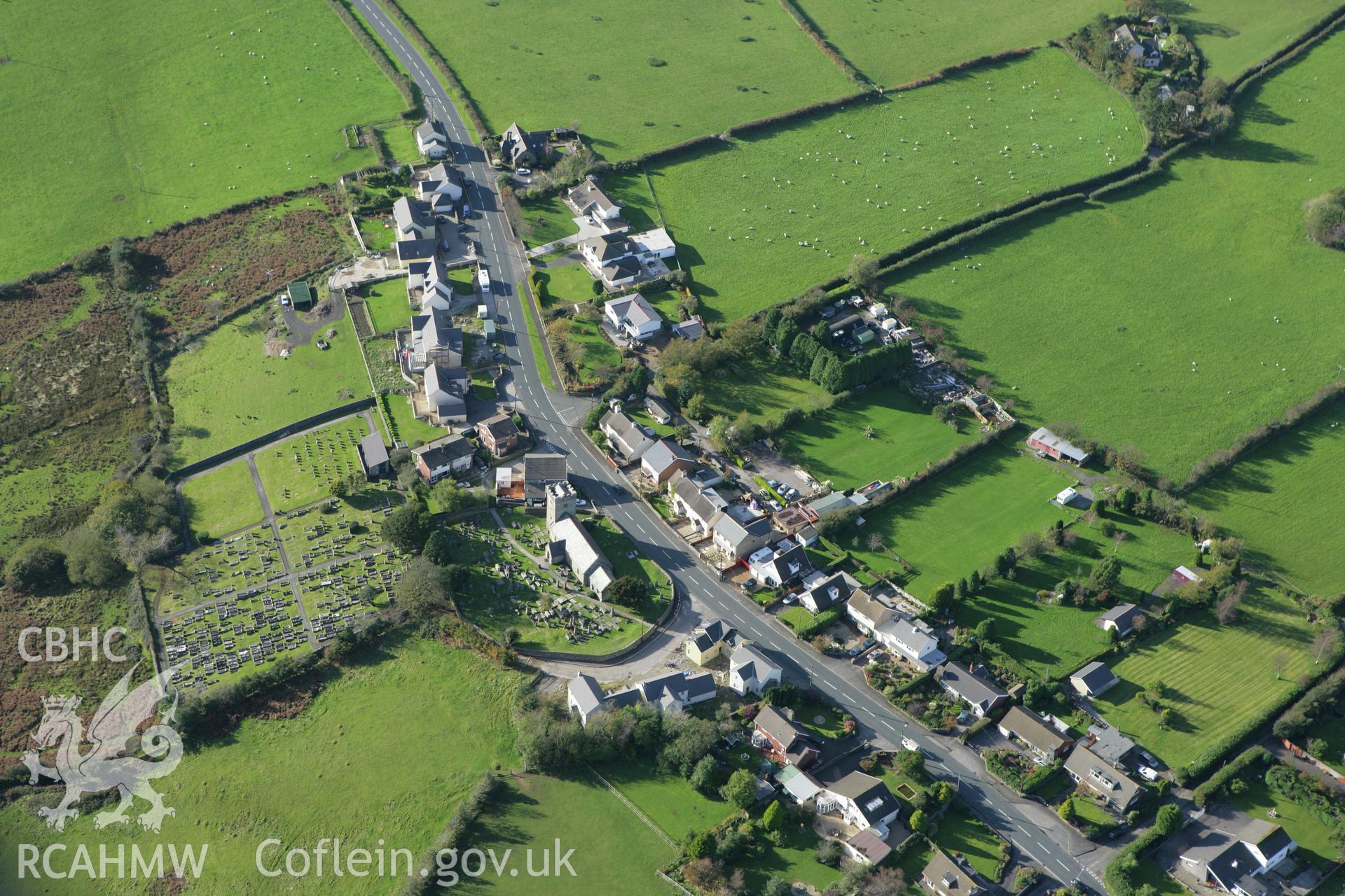 RCAHMW colour oblique photograph of Glynogwr village, with St Tyfodwg's Church. Taken by Toby Driver on 16/10/2008.