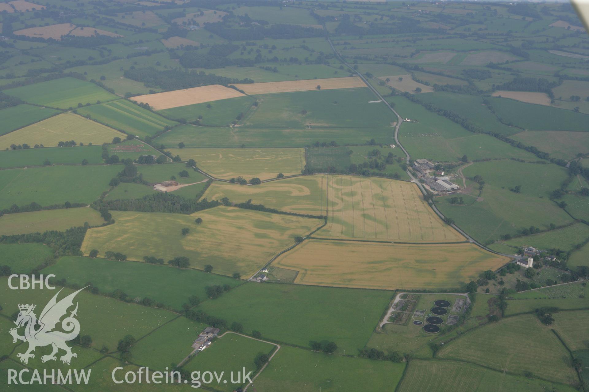 RCAHMW colour oblique photograph of Kilford Farm Barrow and Enclosure cropmarks. Taken by Toby Driver on 24/07/2008.