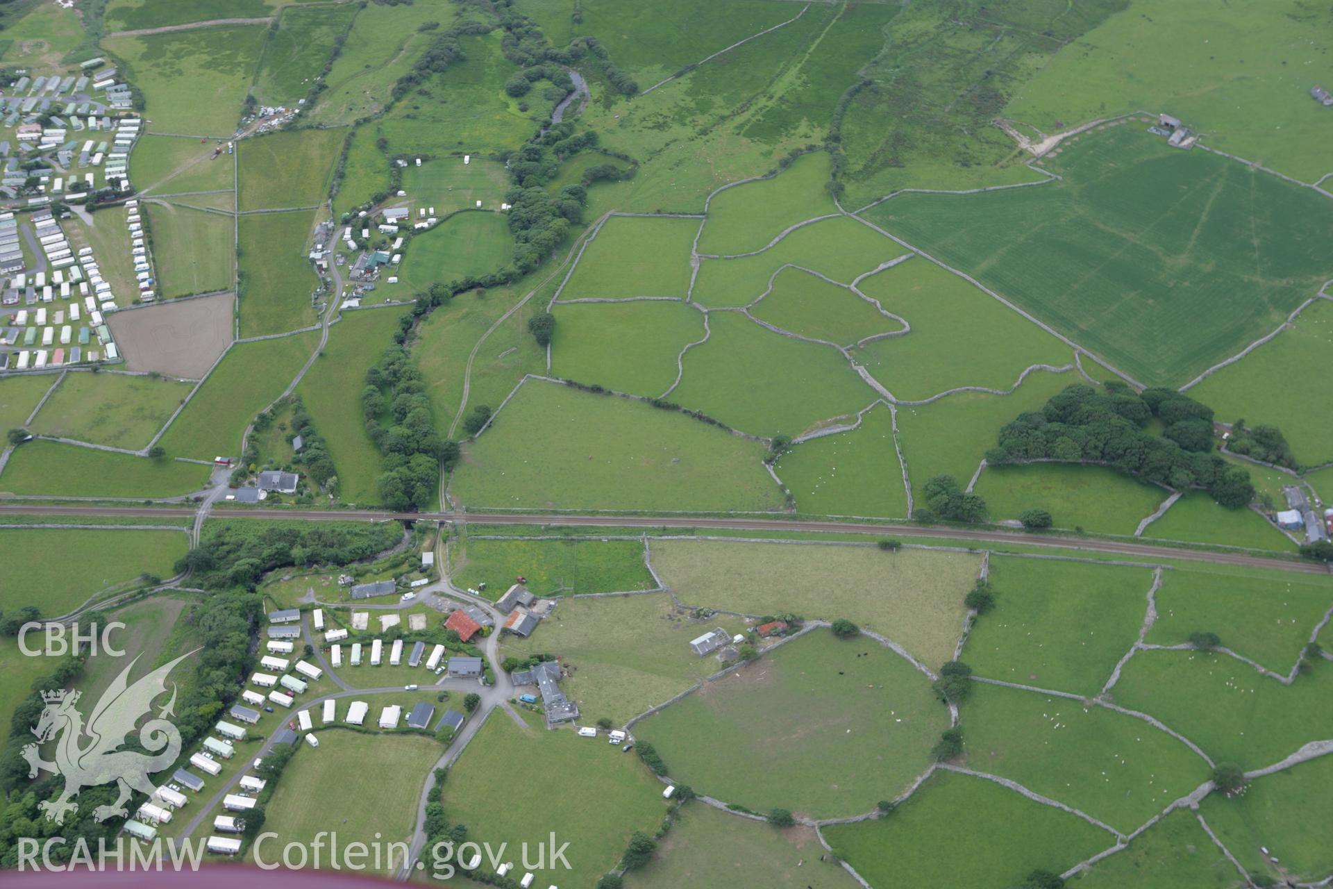 RCAHMW colour oblique photograph of Ty'n-y-cae field system with parchmarks of field boundaries. Taken by Toby Driver on 13/06/2008.