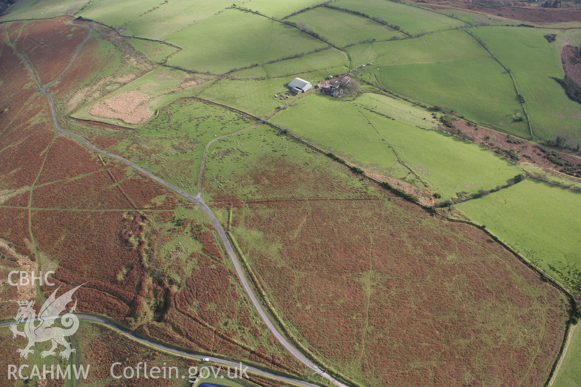 RCAHMW colour oblique photograph of Bryn y Wrach, quarrying and earthworks of field system and trackways. Taken by Toby Driver on 12/11/2008.