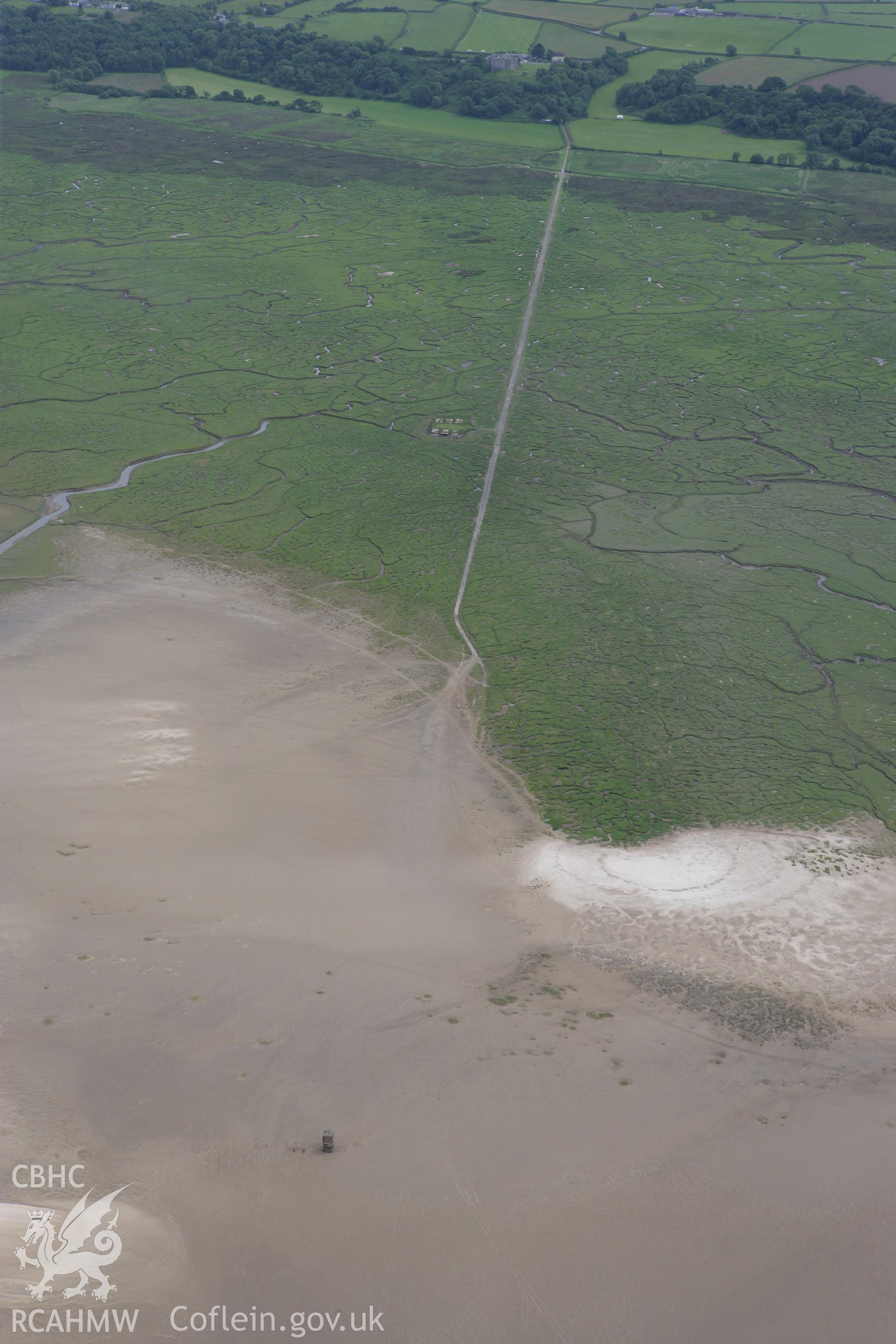 RCAHMW colour oblique photograph of causeway with WW2 lookout tower, Llanrhidian Marshes. Taken by Toby Driver on 20/06/2008.