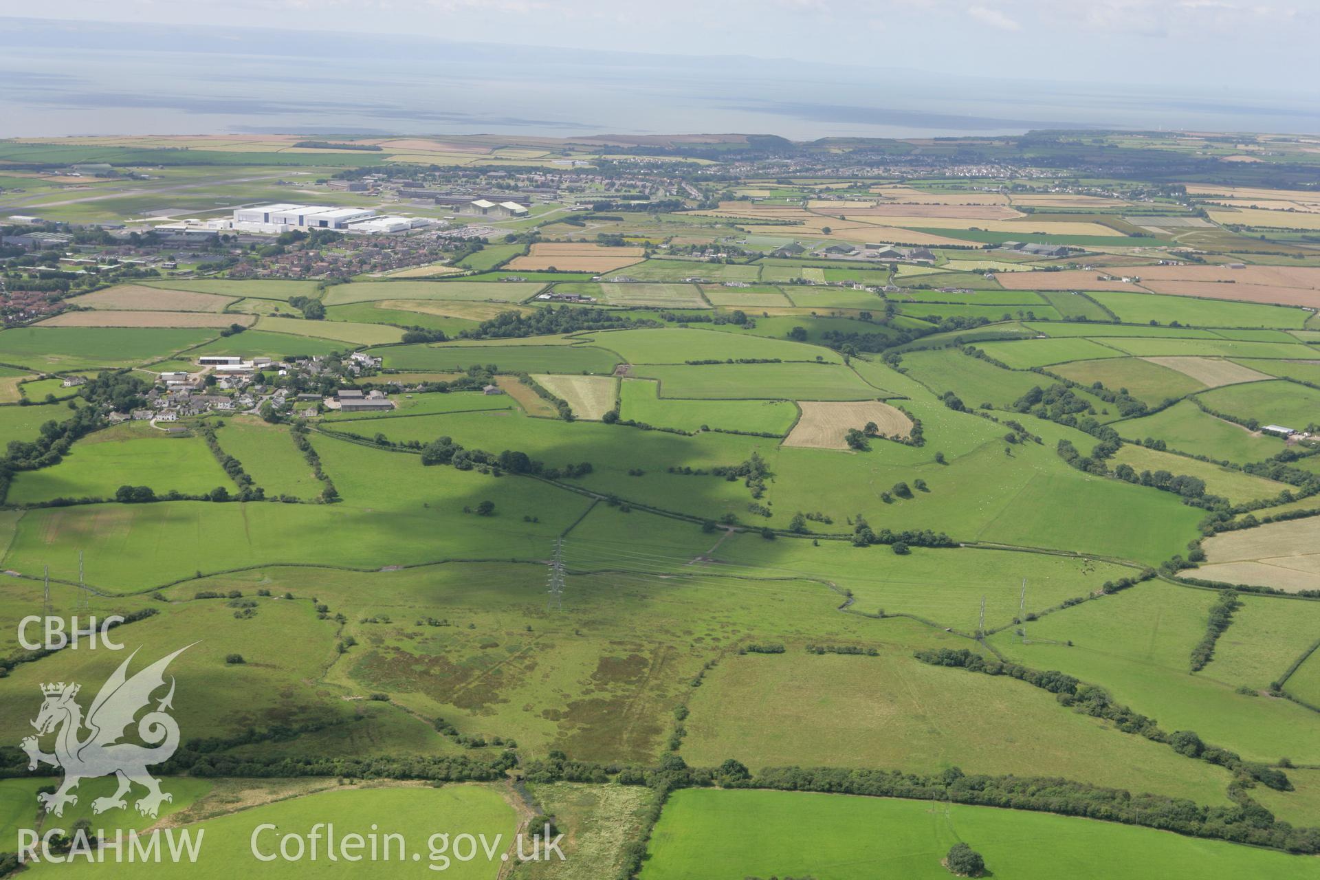 RCAHMW colour oblique photograph of landscape looking north-west over the site of Causewayed Enclosure, Flemingstone. Taken by Toby Driver on 21/07/2008.