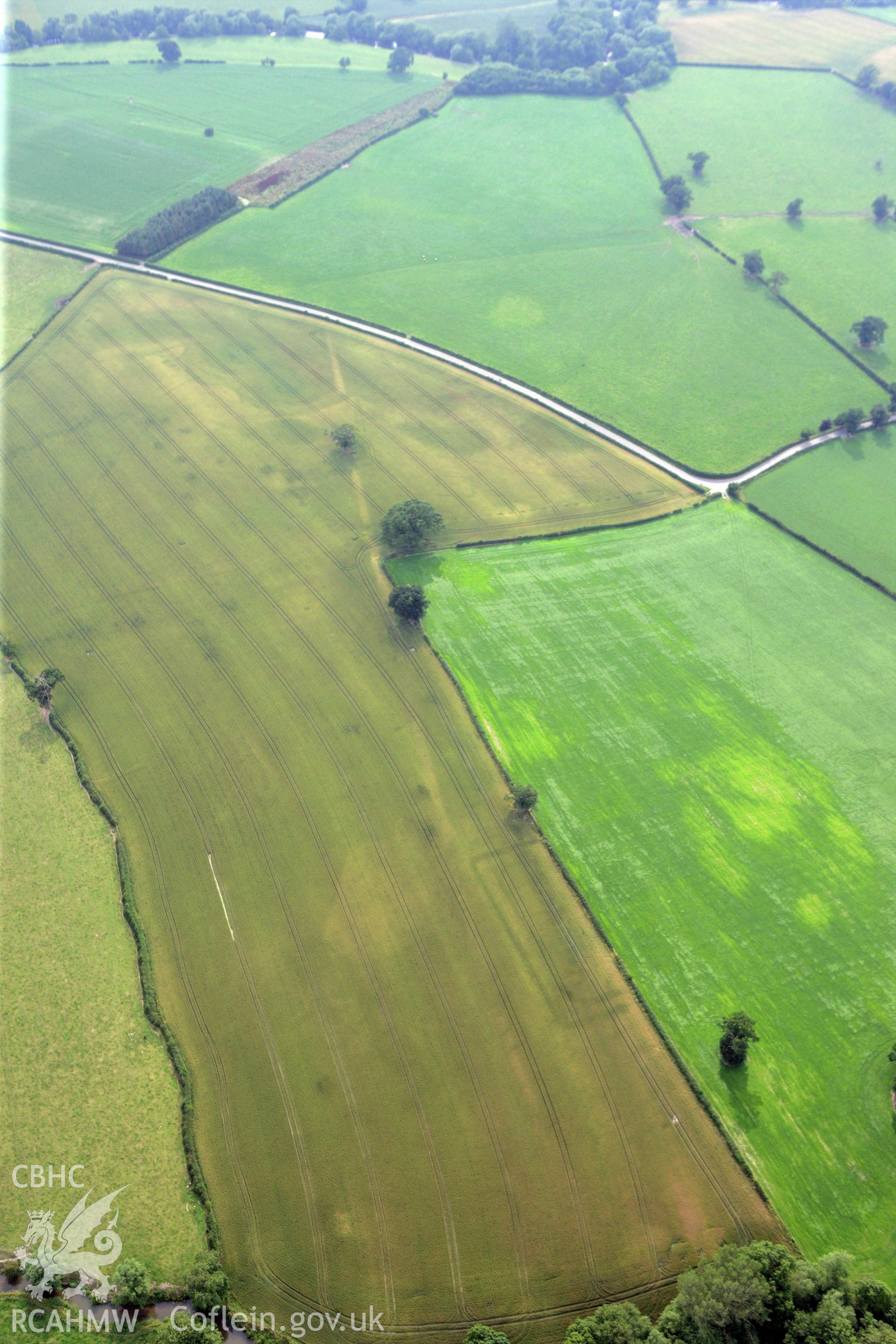 RCAHMW colour oblique photograph of Forden Gaer double-ditched enclosure or 'Tremenos', temple enclosure. Taken by Toby Driver on 24/07/2008.