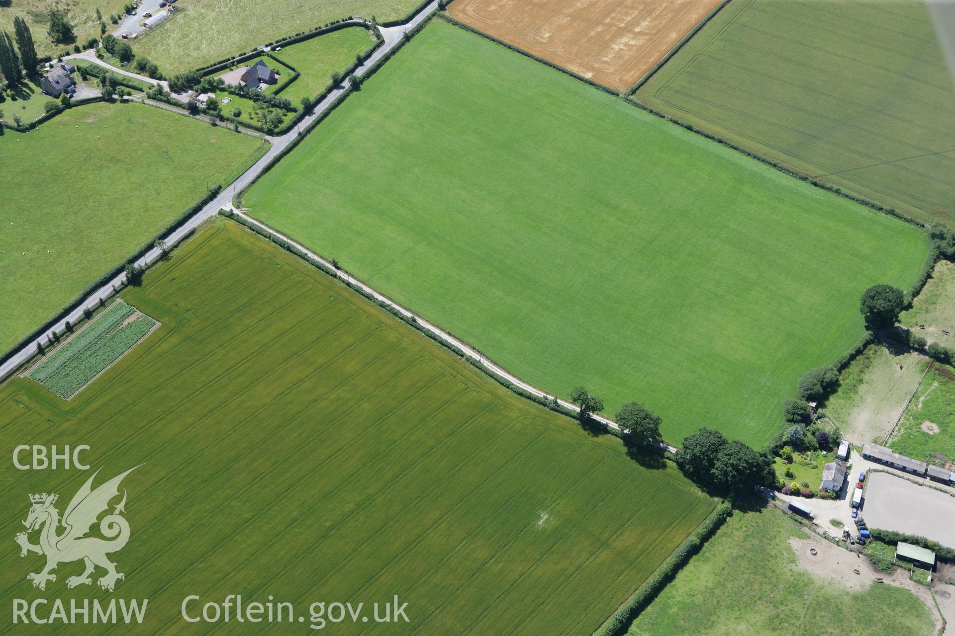 RCAHMW colour oblique photograph of poorly defined cropmarks, The Ditches, ENGLAND. Taken by Toby Driver on 21/07/2008.