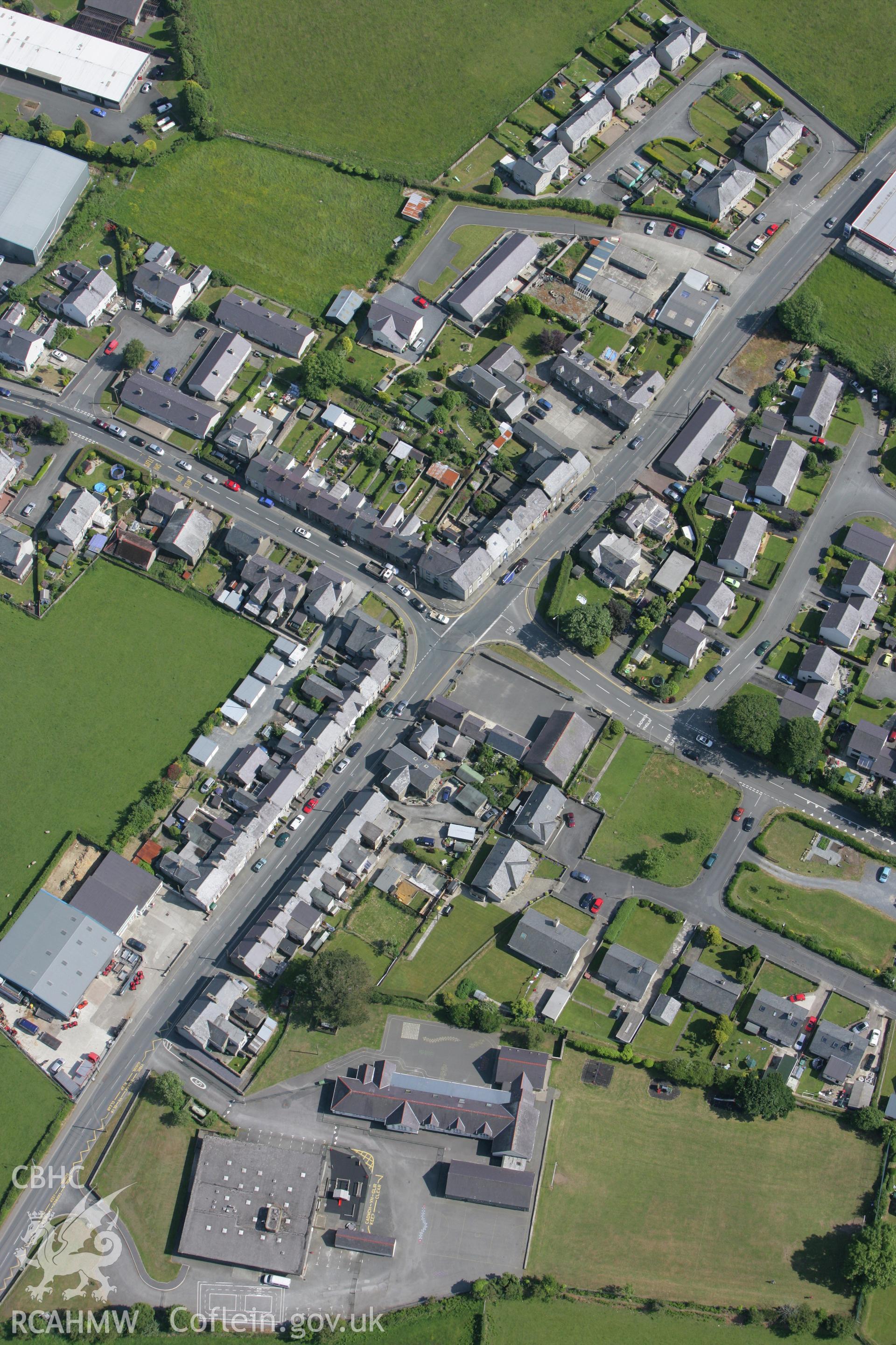 RCAHMW colour oblique photograph of Ysgol Bro Plennydd and Ysgol Hafod Lon, Four Crosses. Taken by Toby Driver on 13/06/2008.