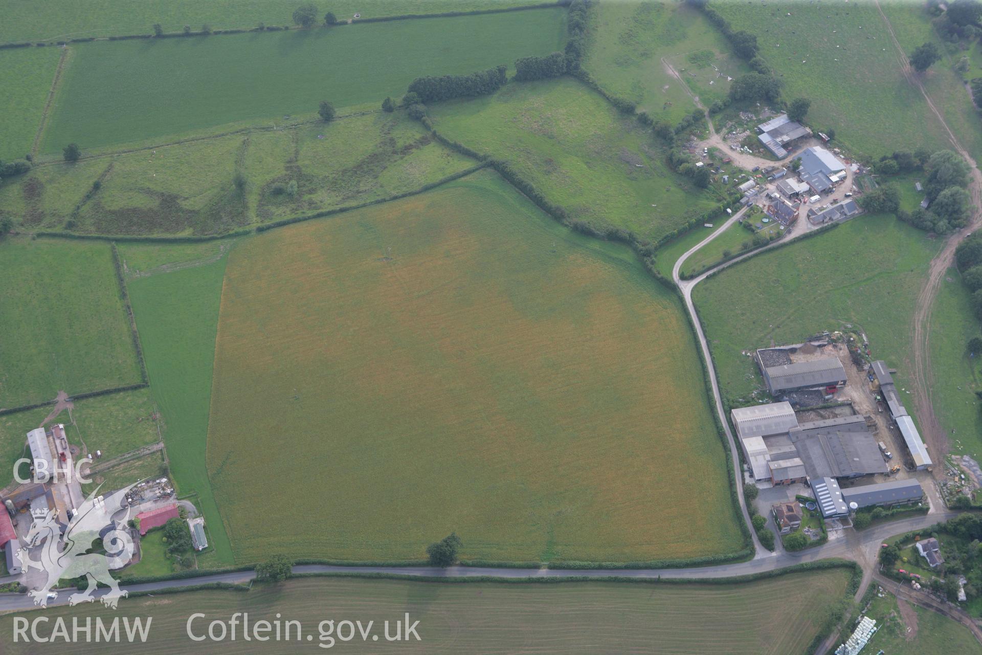 RCAHMW colour oblique photograph of cropmarks to the north-west of Rhydonen farm. Taken by Toby Driver on 24/07/2008.