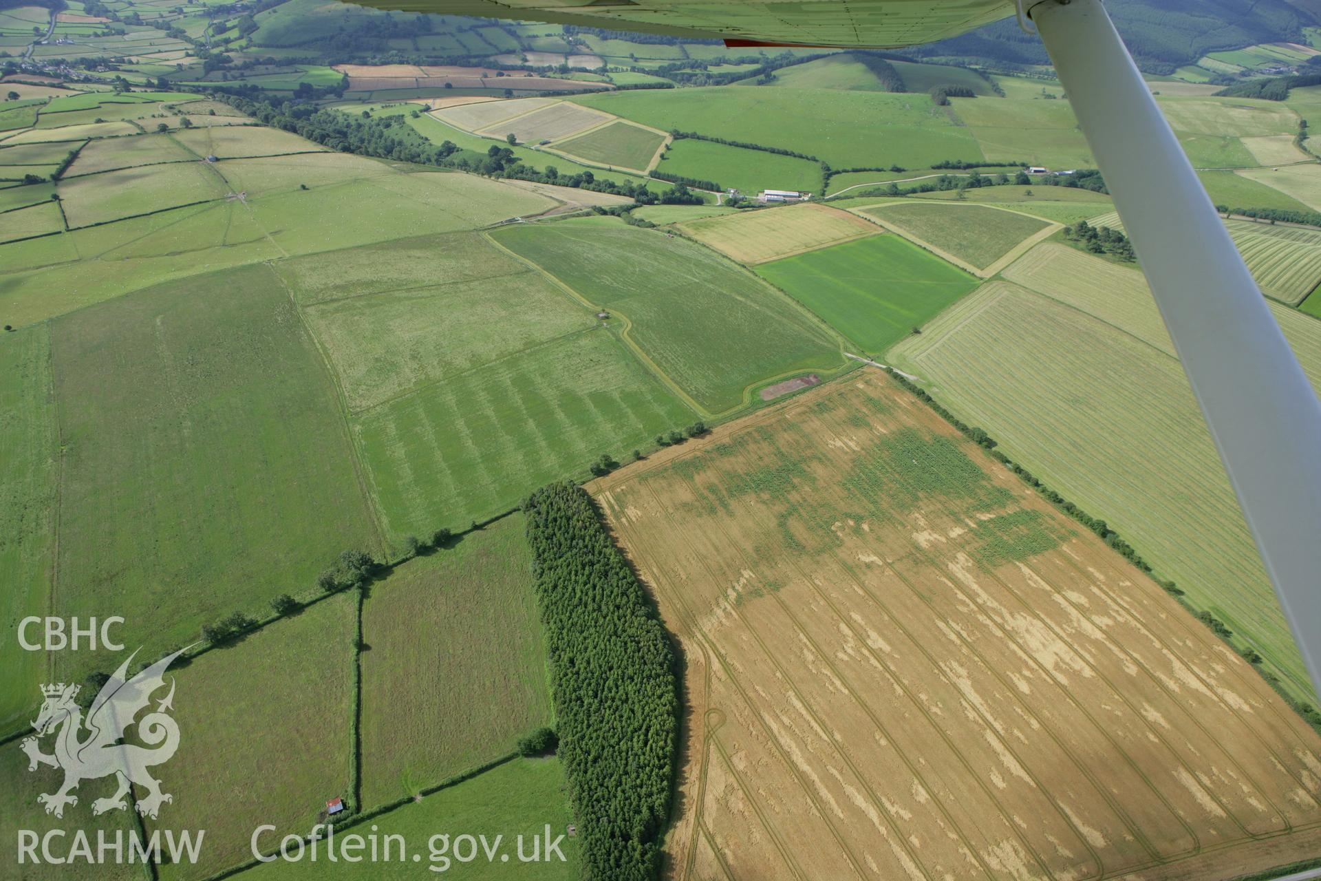 RCAHMW colour oblique photograph of cropmarks of a possible defended enclosure, south of Jacob's Cottage. Taken by Toby Driver on 21/07/2008.