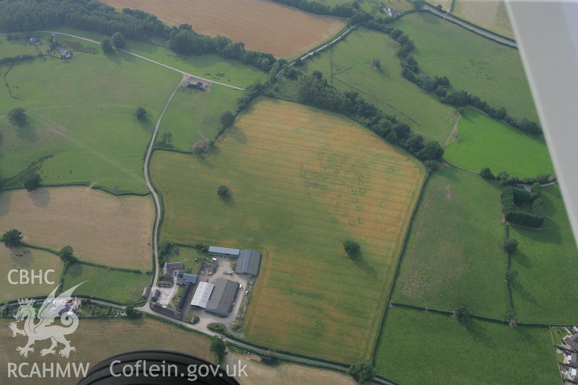RCAHMW colour oblique photograph of cropmarks north of Glan Clwyd farm. Taken by Toby Driver on 24/07/2008.