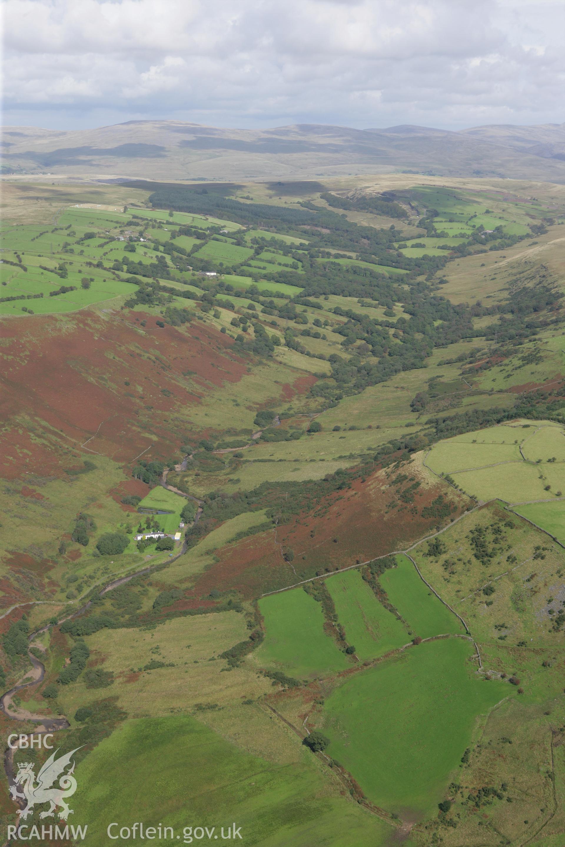 RCAHMW colour oblique photograph of landscape looking north down River Egel valley, with Allt-y-Cadno farmstead, now in ruins. Taken by Toby Driver on 12/09/2008.