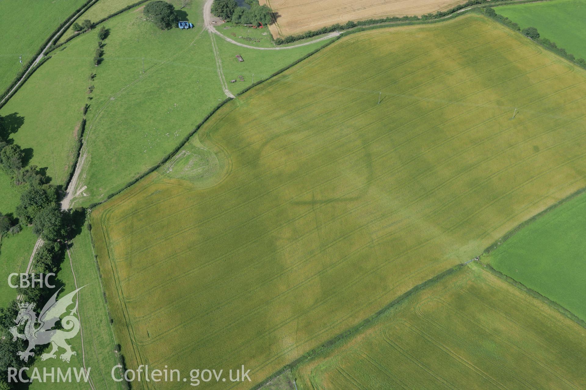 RCAHMW colour oblique photograph of cropmark enclosure north-east of Henfron. Taken by Toby Driver on 21/07/2008.