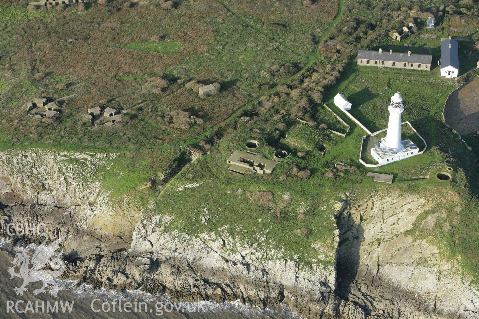 RCAHMW colour oblique photograph of Flat Holm Lighthouse with Coastal and Anti-aircraft Defences. Taken by Toby Driver on 12/11/2008.