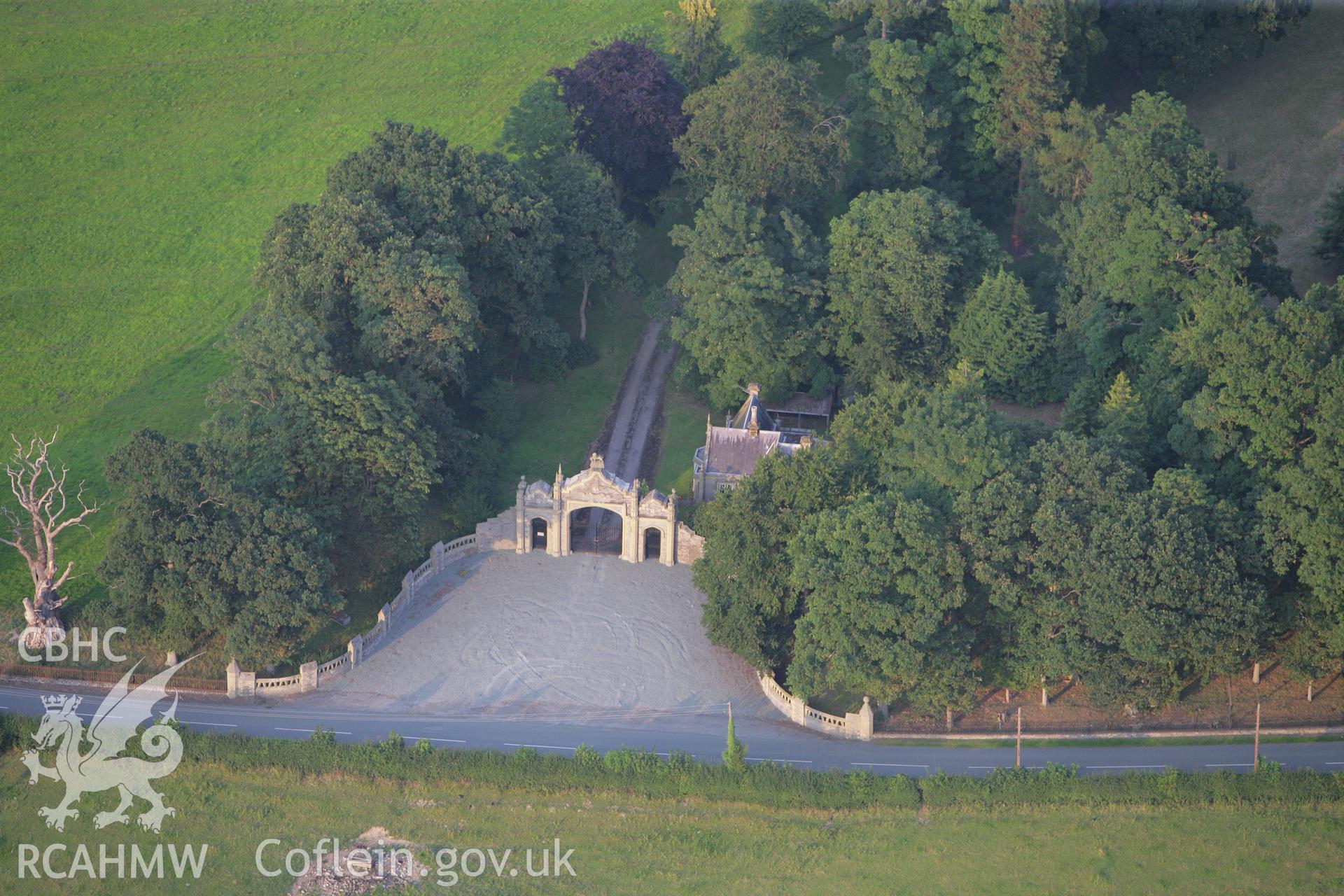 RCAHMW colour oblique photograph of Leighton Hall Lodge, with archway and gates. Taken by Toby Driver on 24/07/2008.