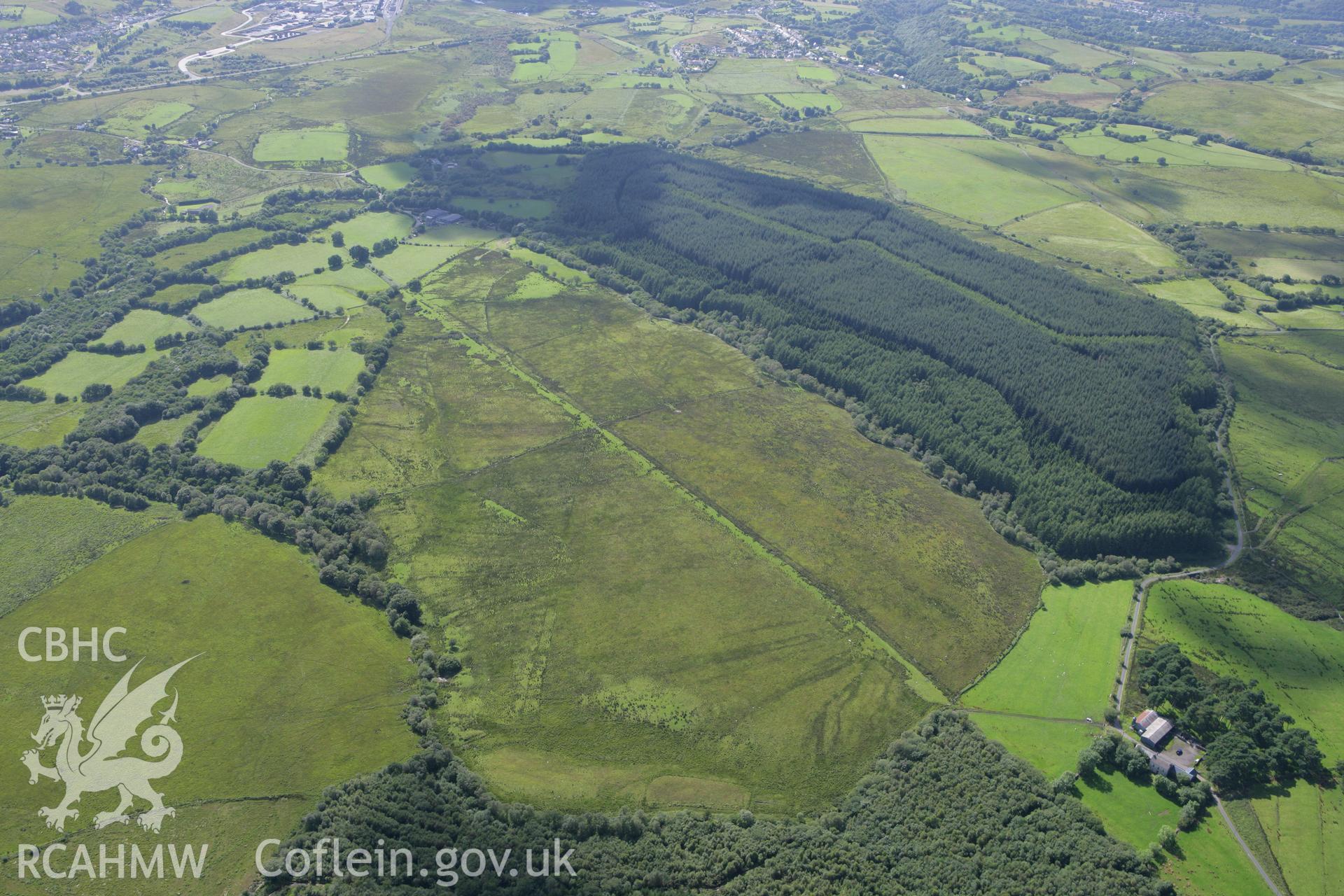 RCAHMW colour oblique aerial photograph of a section of Sarn Helen Roman Road northeast of Coelbren Fort. Taken on 30 July 2007 by Toby Driver