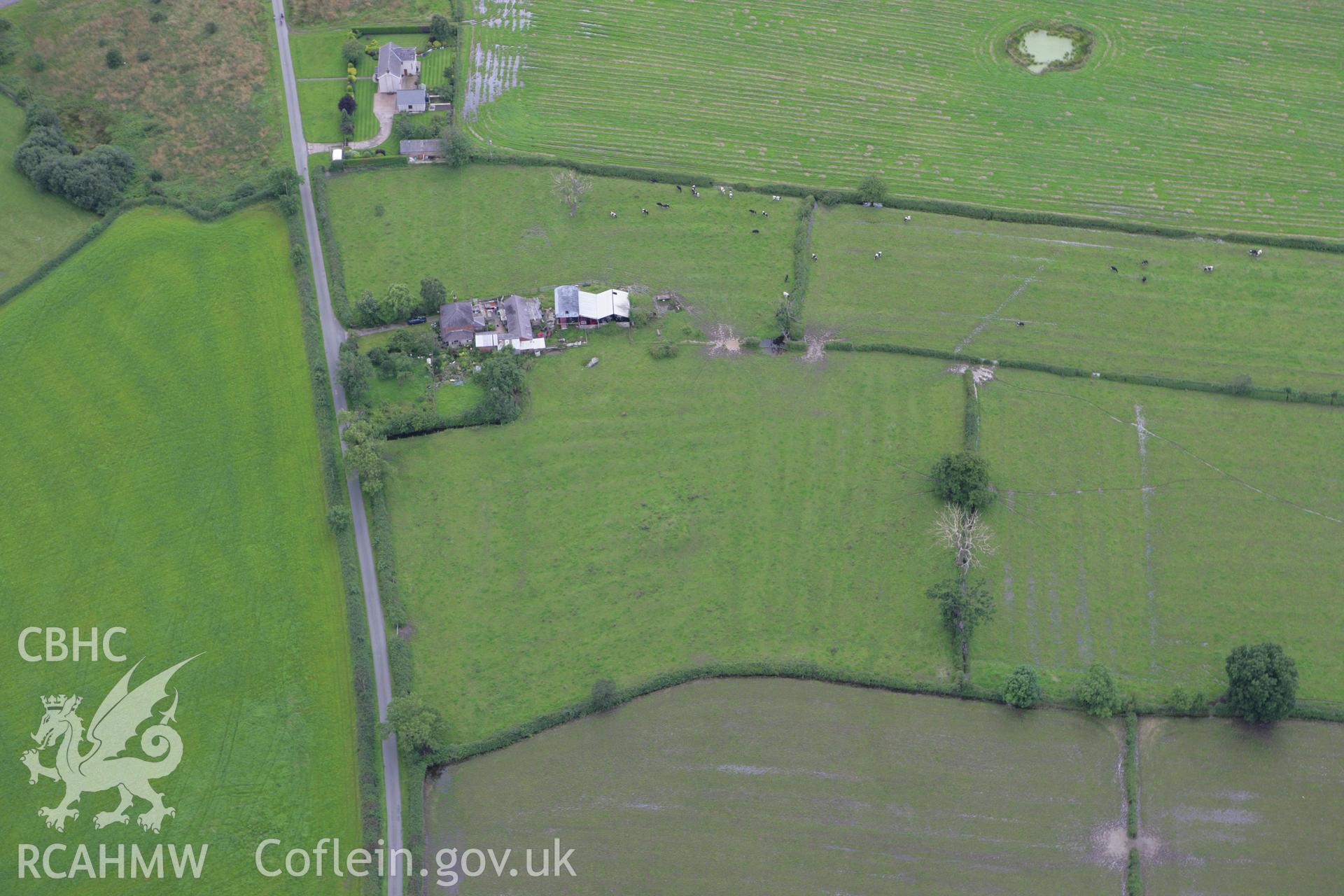 RCAHMW colour oblique aerial photograph of Sutton Green Round Barrow. Taken on 24 July 2007 by Toby Driver
