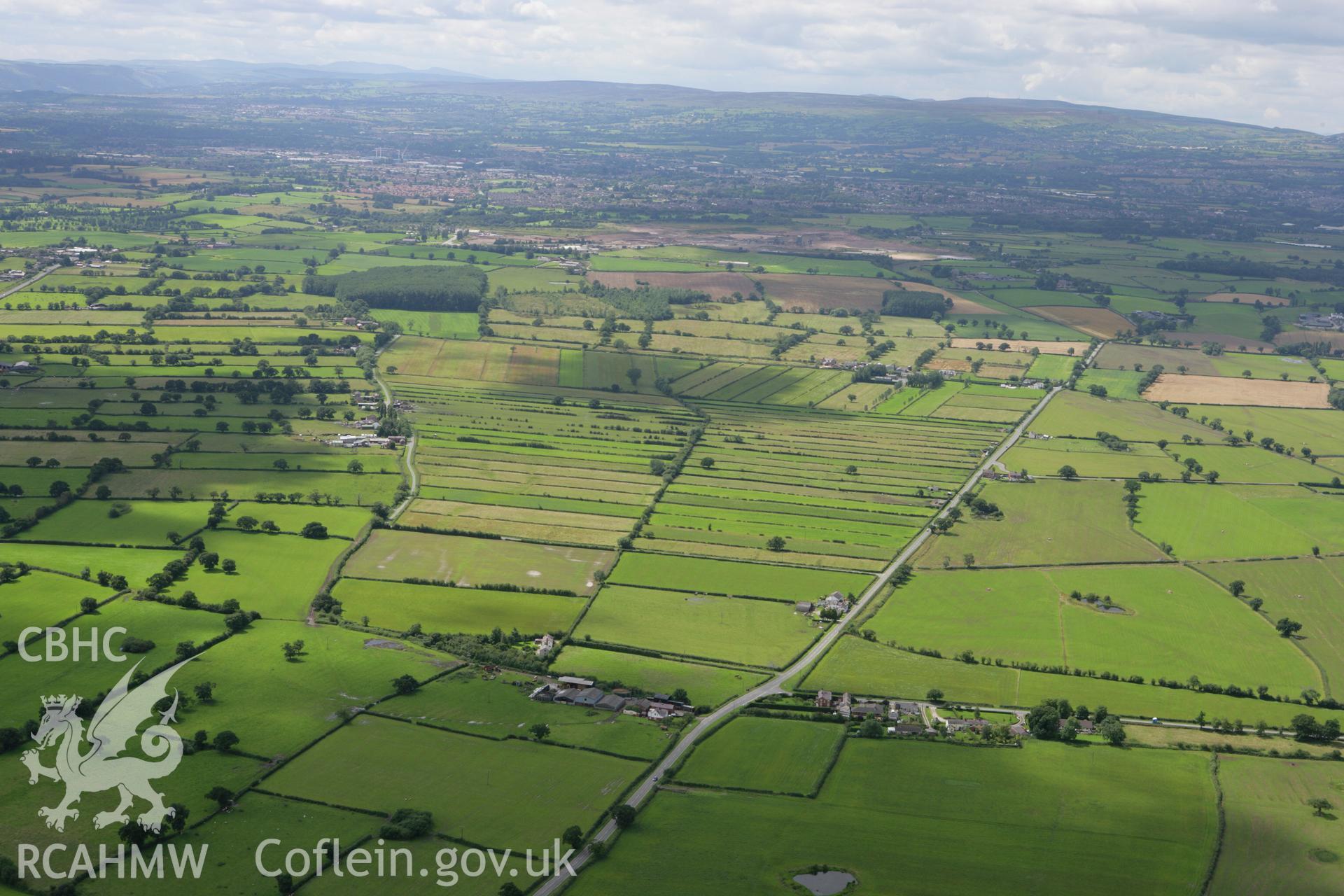 RCAHMW colour oblique aerial photograph of common land field system, Commonwood, Wrexham, Denbighshire. Taken on 24 July 2007 by Toby Driver
