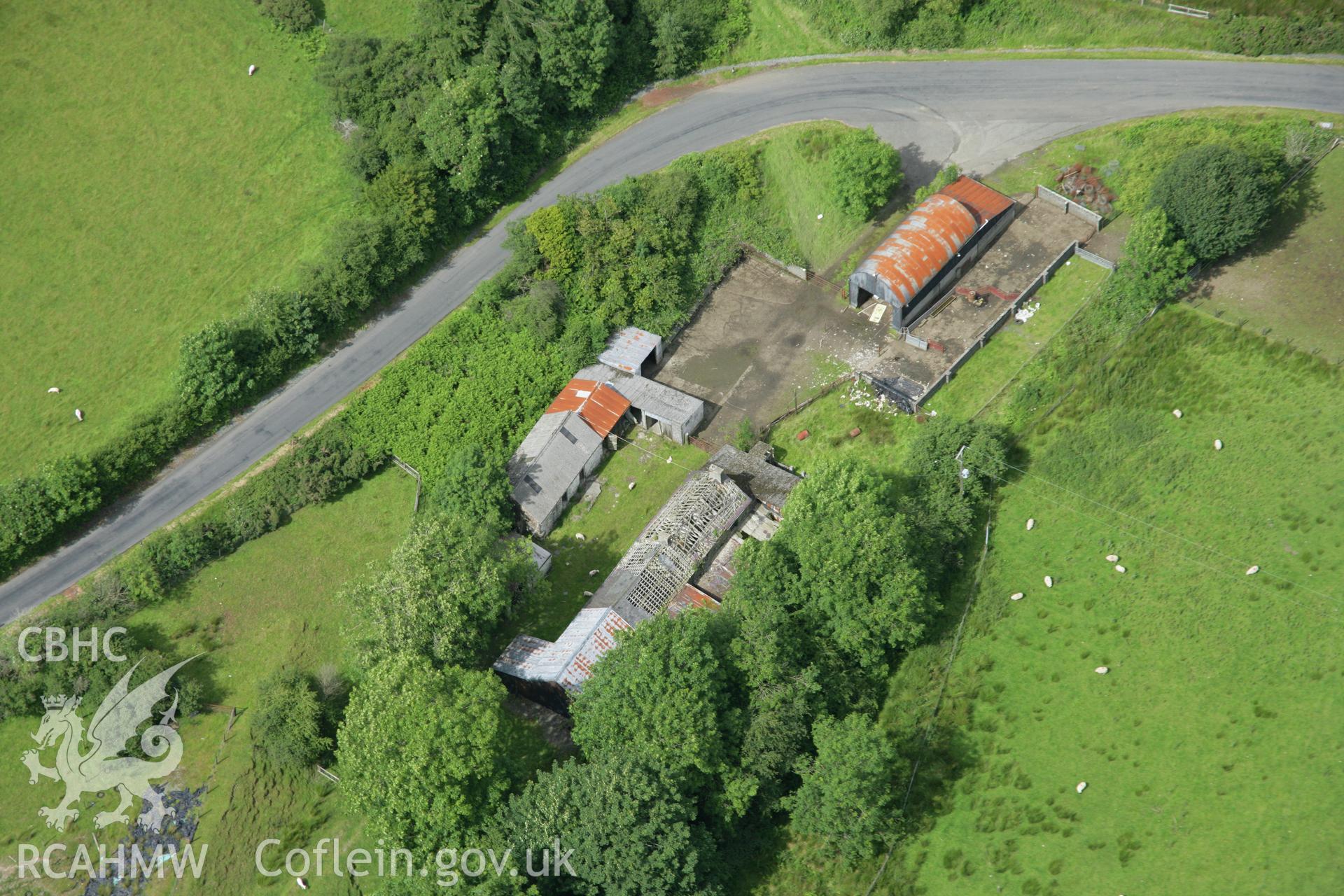 RCAHMW colour oblique aerial photograph of Spite Inn, showing the building prior to demolition. Taken on 09 July 2007 by Toby Driver