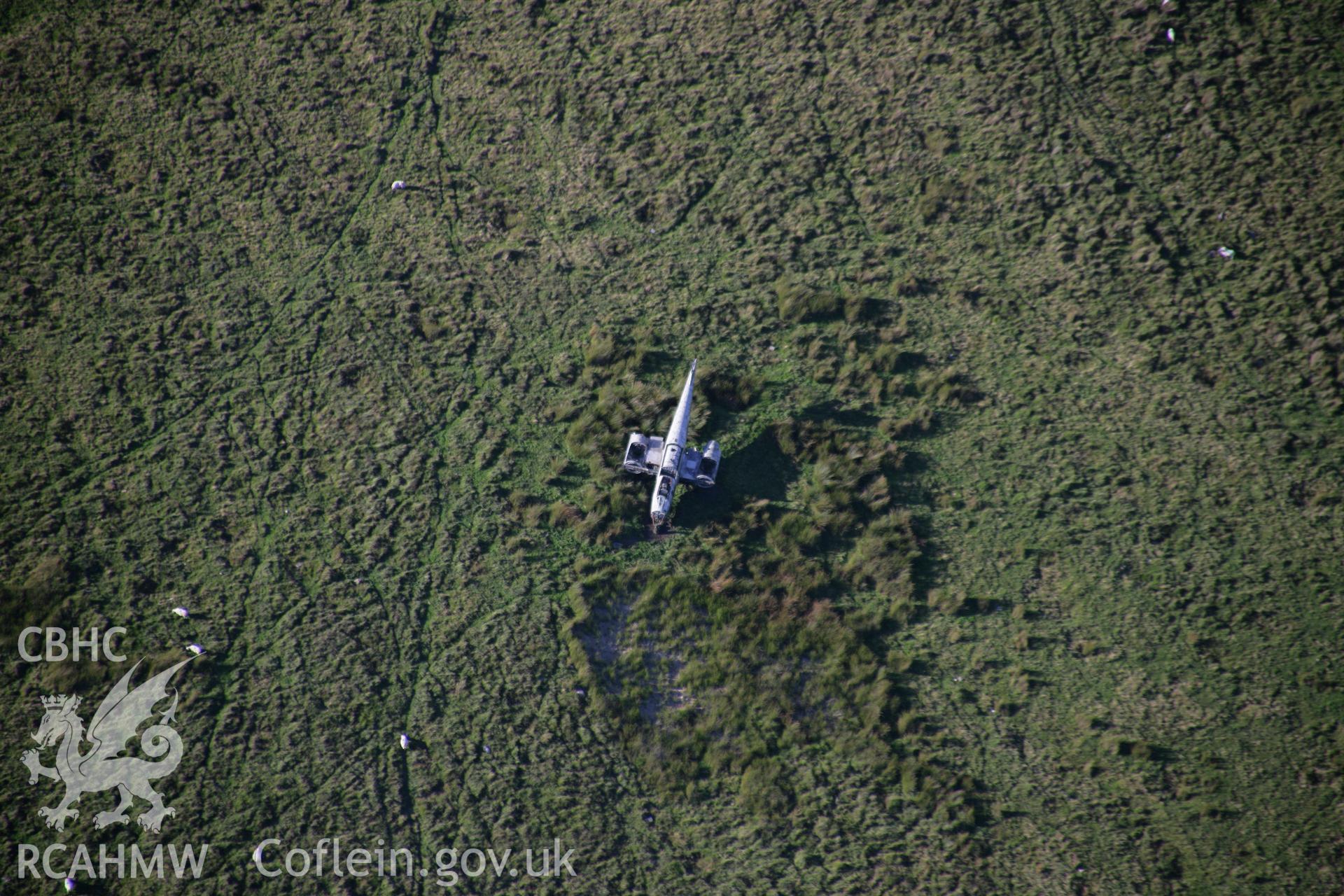 RCAHMW colour oblique aerial photograph of Sennybridge Military Training Area, Mynydd Epynt, showing a wrecked Meteor aircraft used as a target. Taken on 08 August 2007 by Toby Driver
