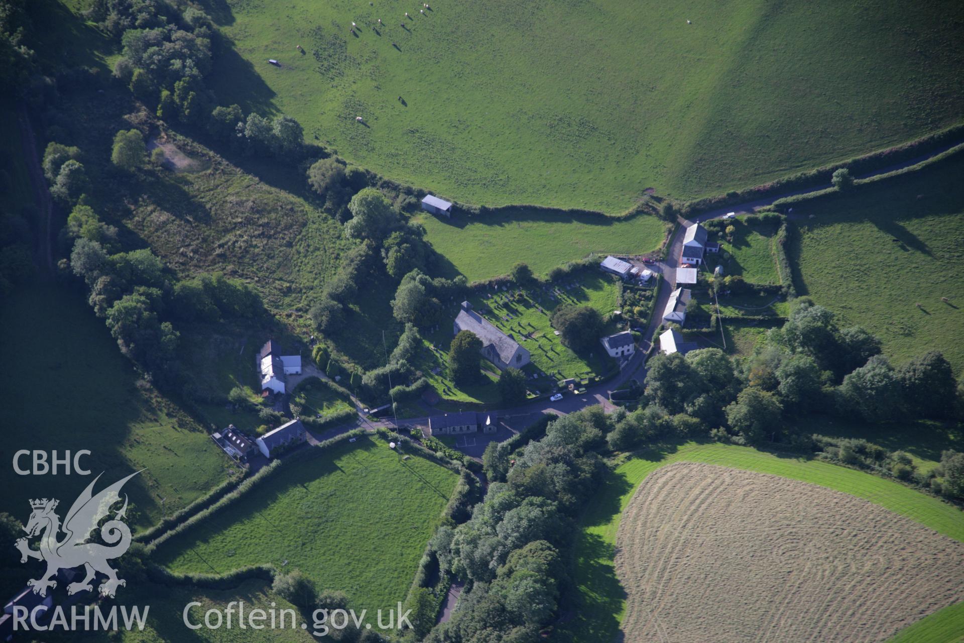 RCAHMW colour oblique aerial photograph of Llandeilo'r Fan village. Taken on 08 August 2007 by Toby Driver