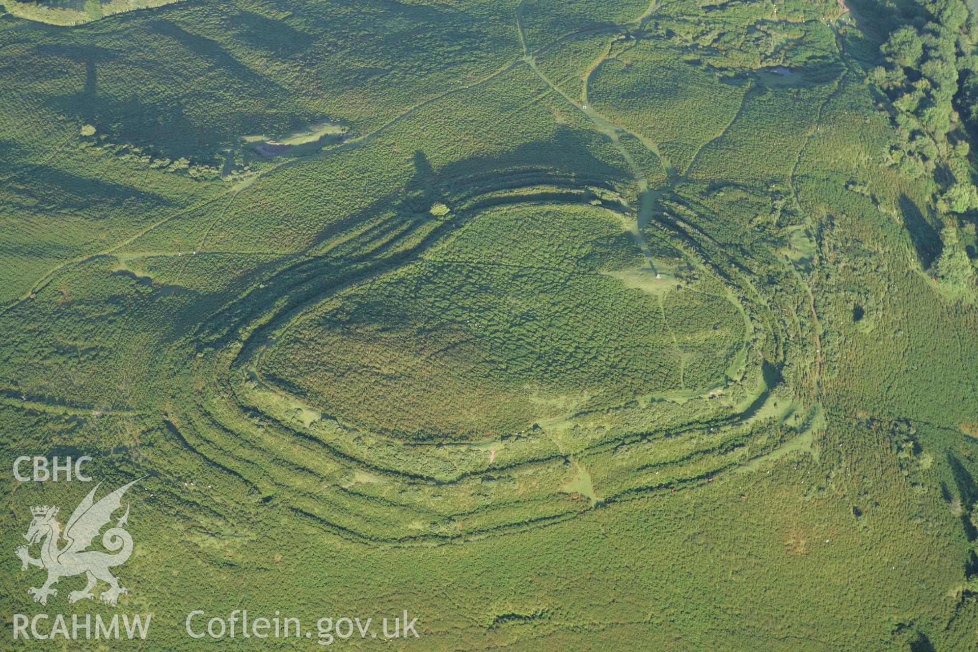 RCAHMW colour oblique aerial photograph of Pen-y-Crug Hillfort. Taken on 08 August 2007 by Toby Driver