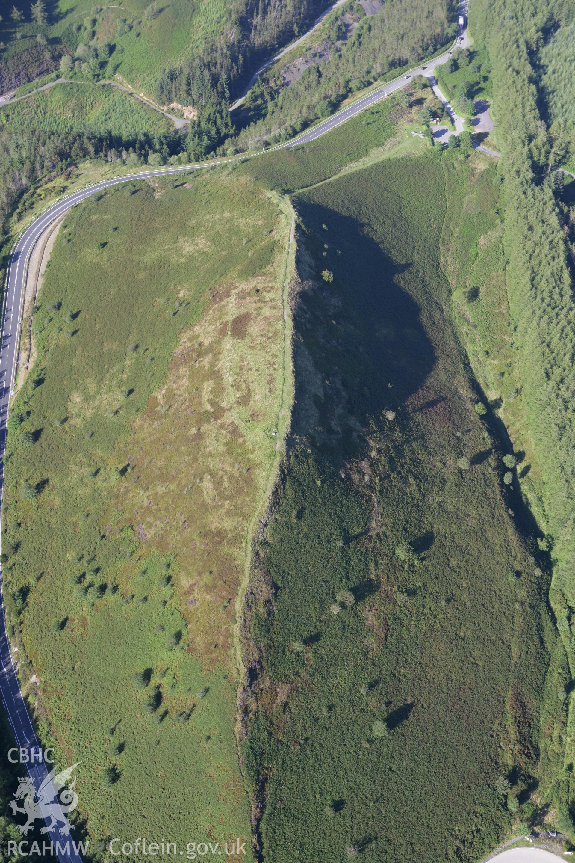 RCAHMW colour oblique aerial photograph of Sugar Loaf Hillfort. Taken on 08 August 2007 by Toby Driver