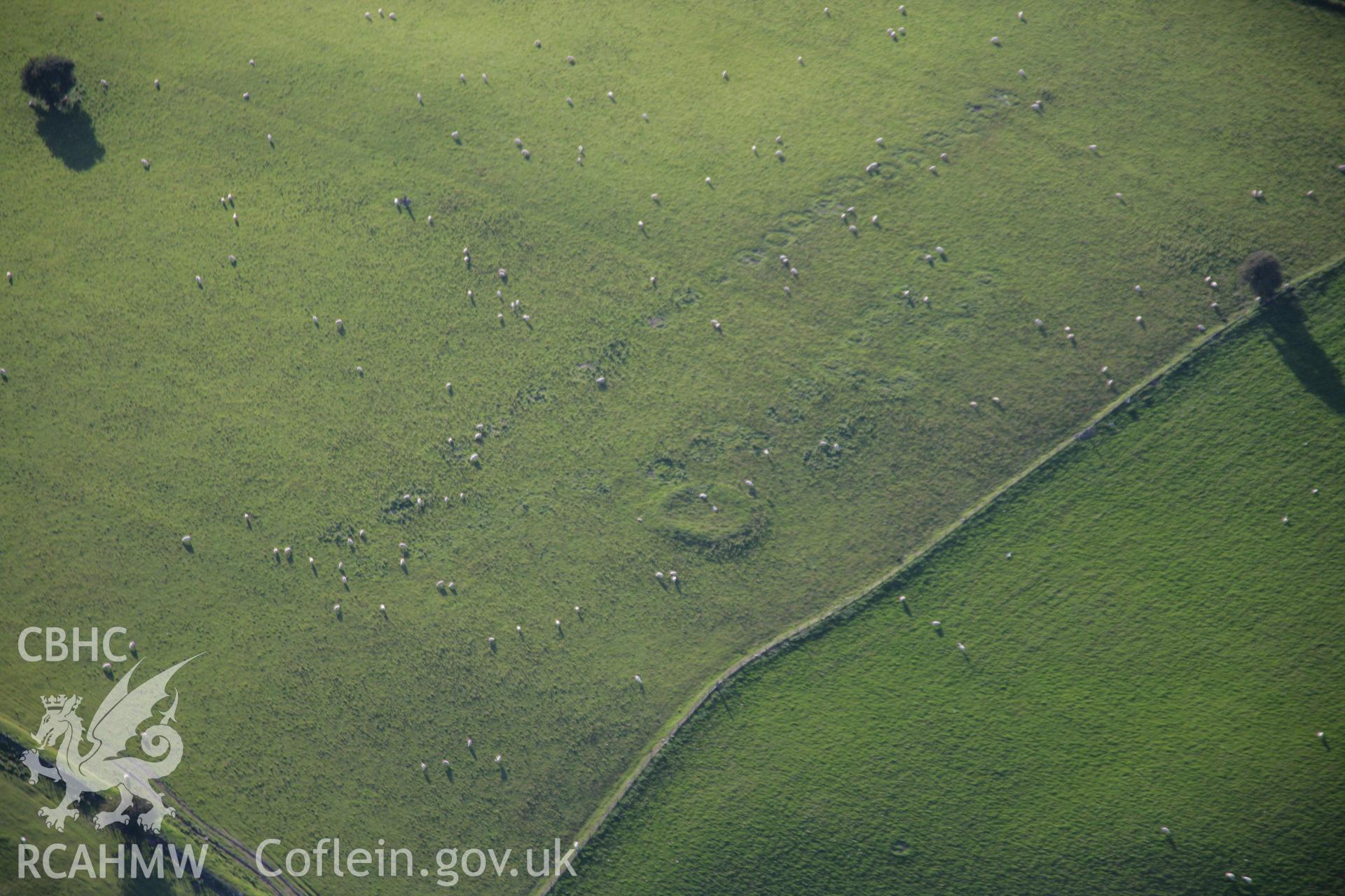 RCAHMW colour oblique aerial photograph of Waun Gynllwch Enclosure. Taken on 08 August 2007 by Toby Driver