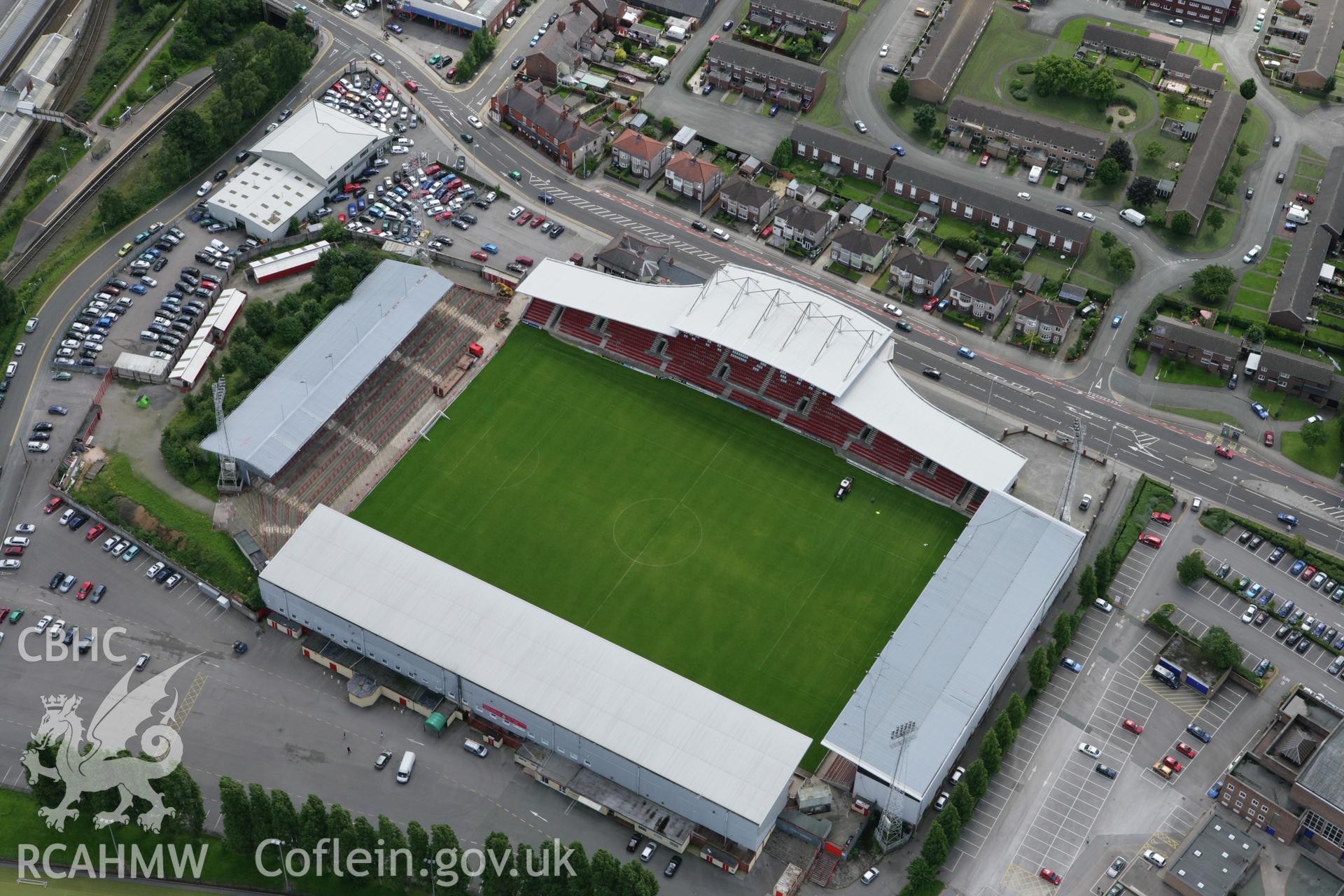 RCAHMW colour oblique aerial photograph of Wrexham, showing the football ground. Taken on 24 July 2007 by Toby Driver