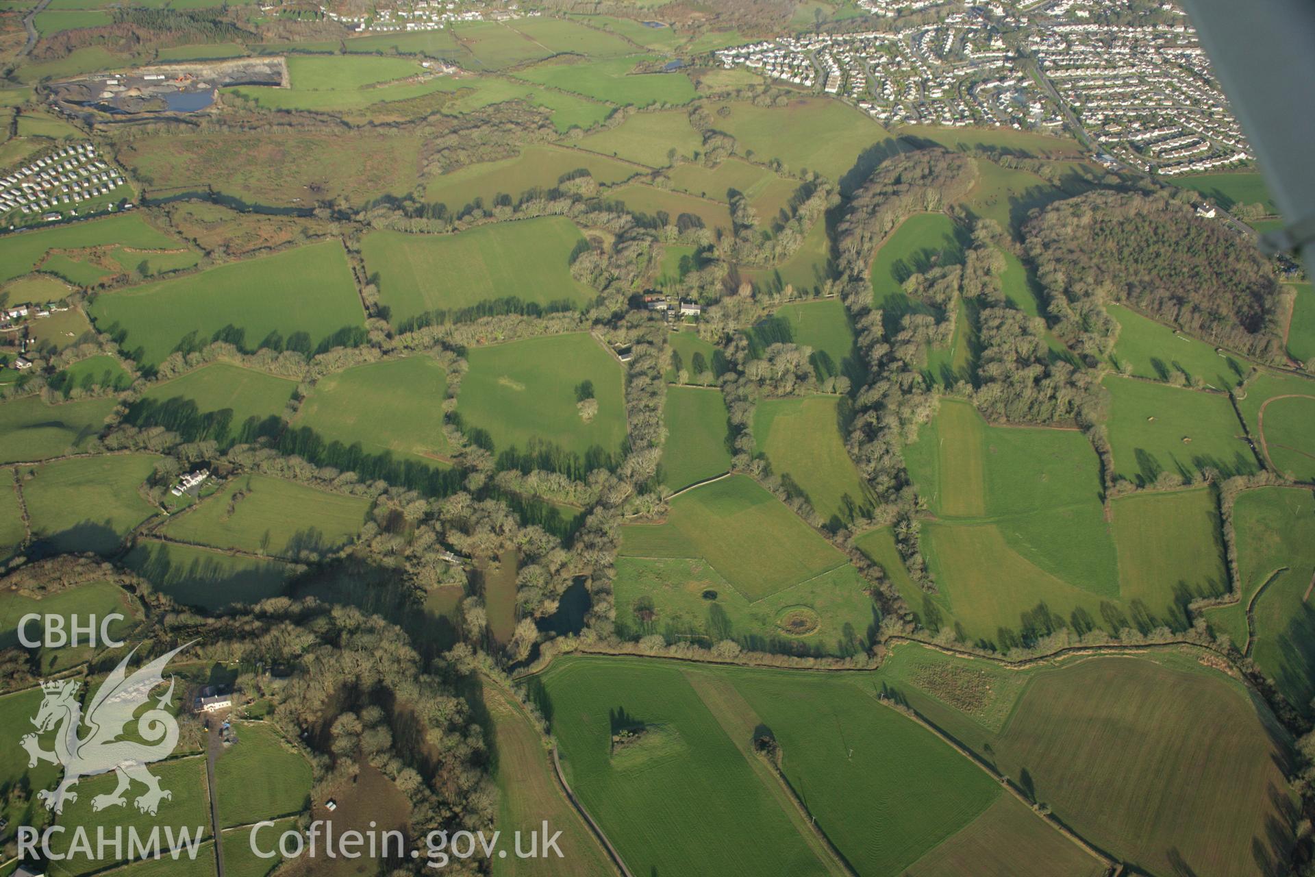 RCAHMW colour oblique aerial photograph of the Viking settlement at Glyn, Llanbedrgoch, and the surrounding landscape. Taken on 25 January 2007 by Toby Driver