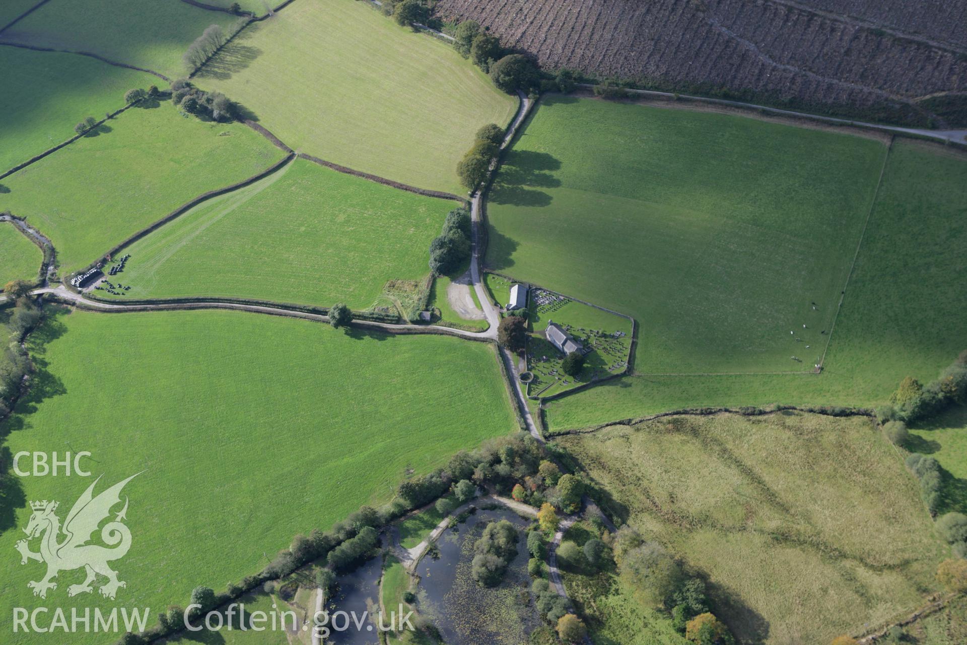 RCAHMW colour oblique photograph of St. Llanllawddog's Church, Llanllawddog. Taken by Toby Driver on 04/10/2007.