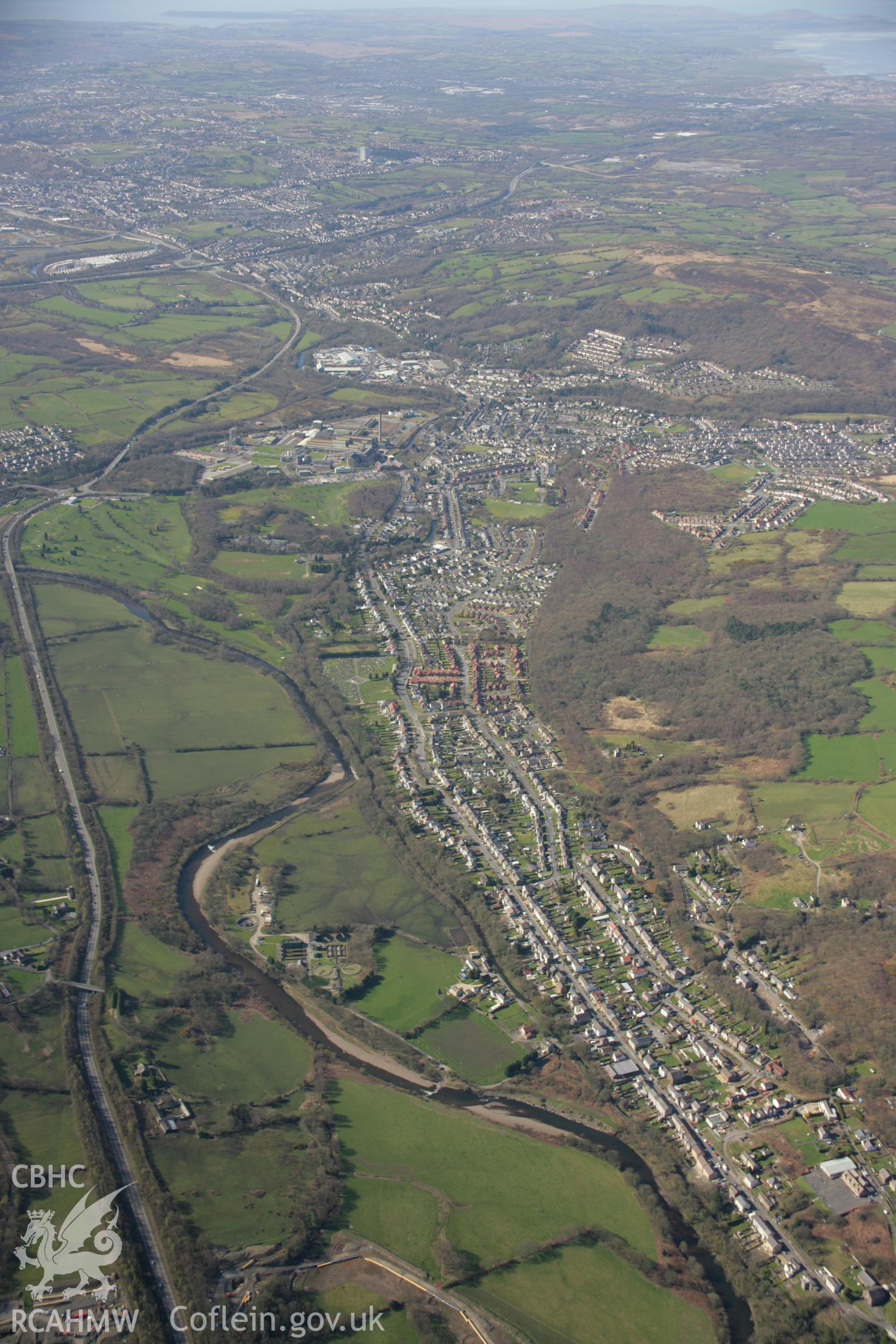 RCAHMW colour oblique aerial photograph of St Michael and All Saints' Church, Swansea Road, Trebanos in high view from the north-east. Taken on 21 March 2007 by Toby Driver