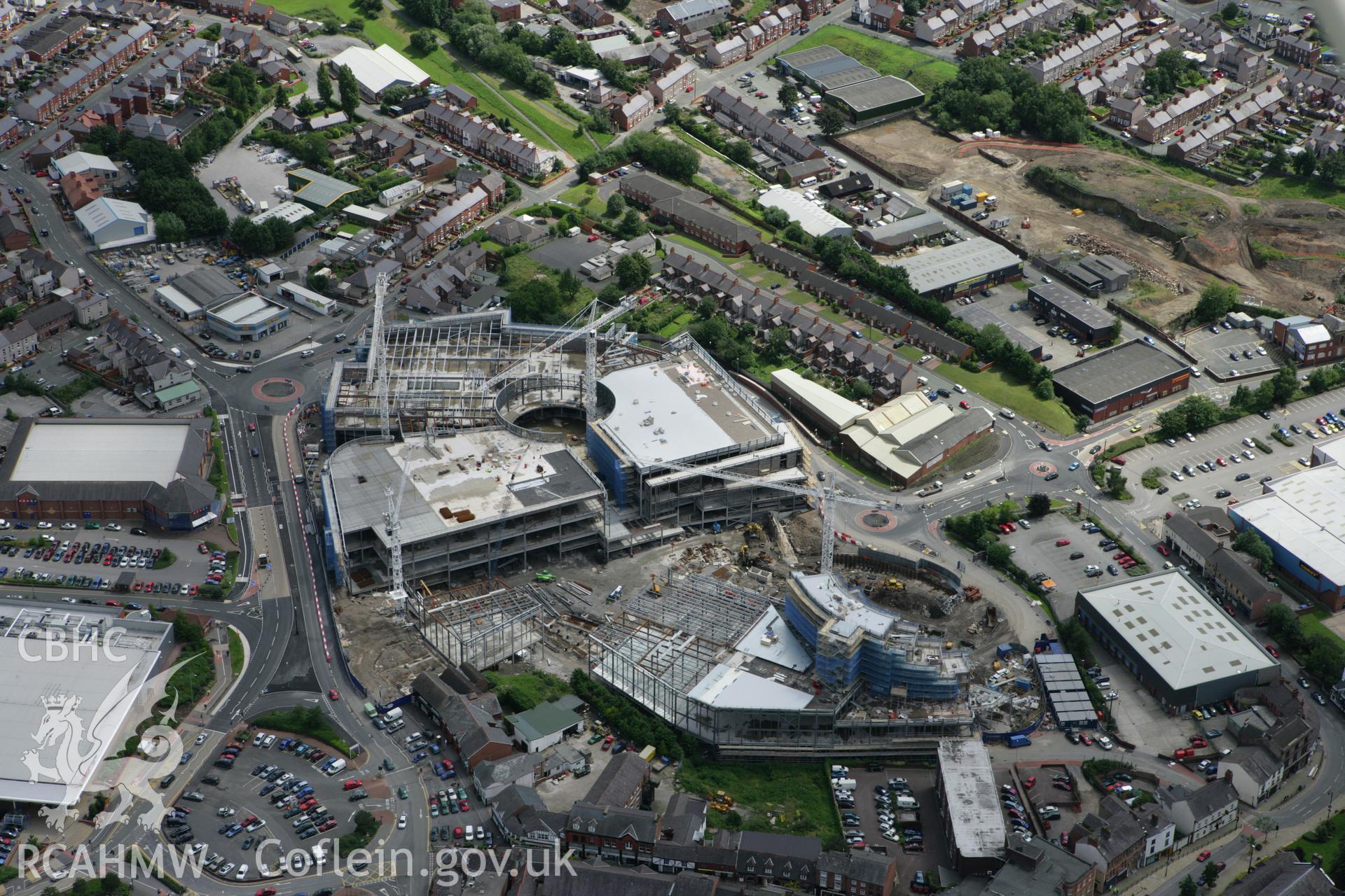 RCAHMW colour oblique aerial photograph of Wrexham, showing construction of a new shopping centre. Taken on 24 July 2007 by Toby Driver