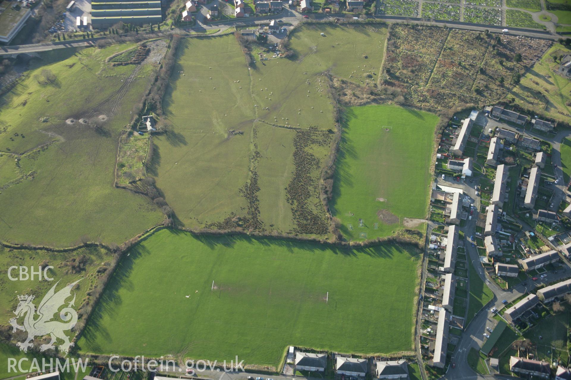 RCAHMW colour oblique aerial photograph of the Tyddyn Pandy Square Barrow Cemetery. Taken on 25 January 2007 by Toby Driver