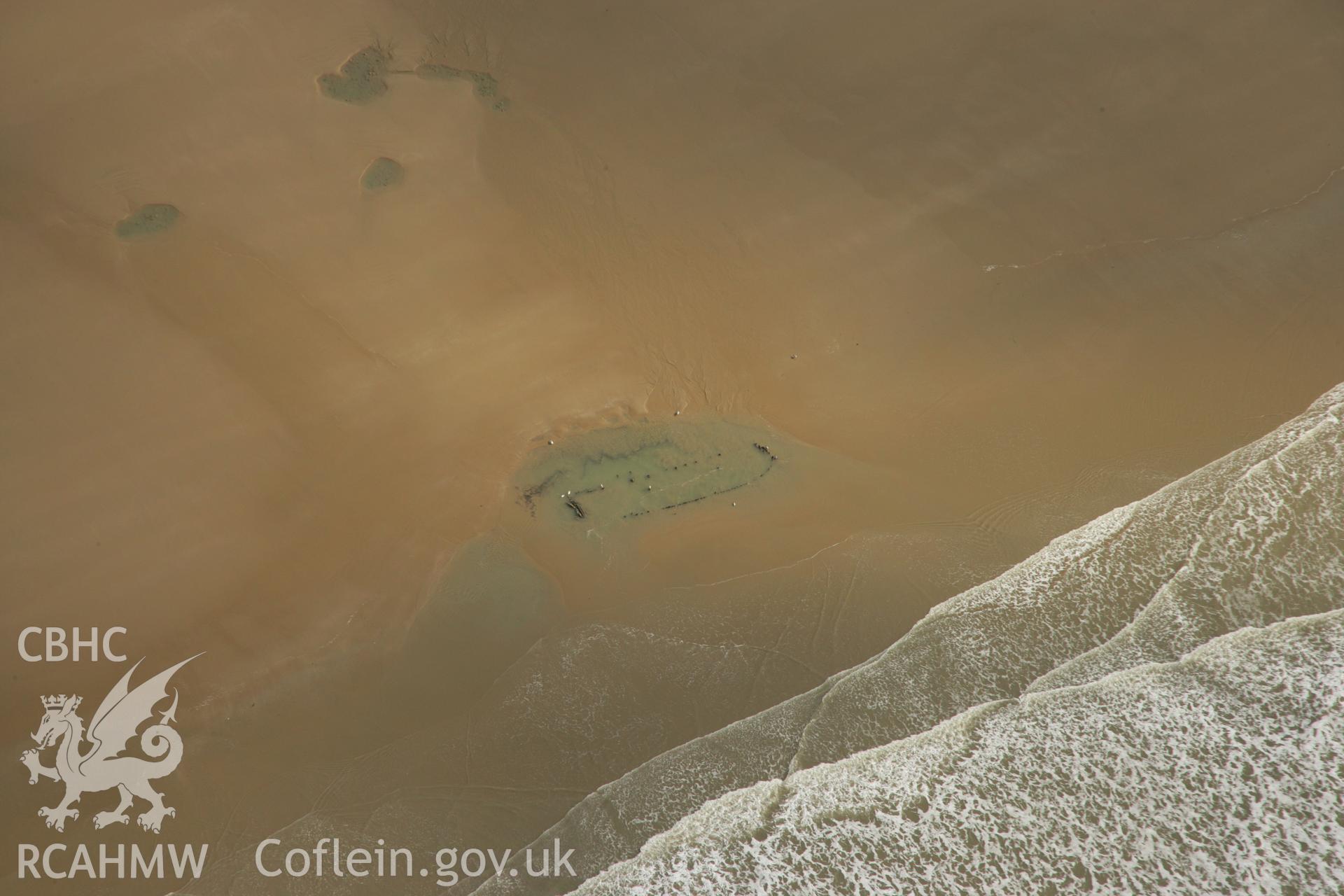 RCAHMW colour oblique aerial photograph of Gwely'r Misgl Wreck on Kenfig Sands. Taken on 16 March 2007 by Toby Driver
