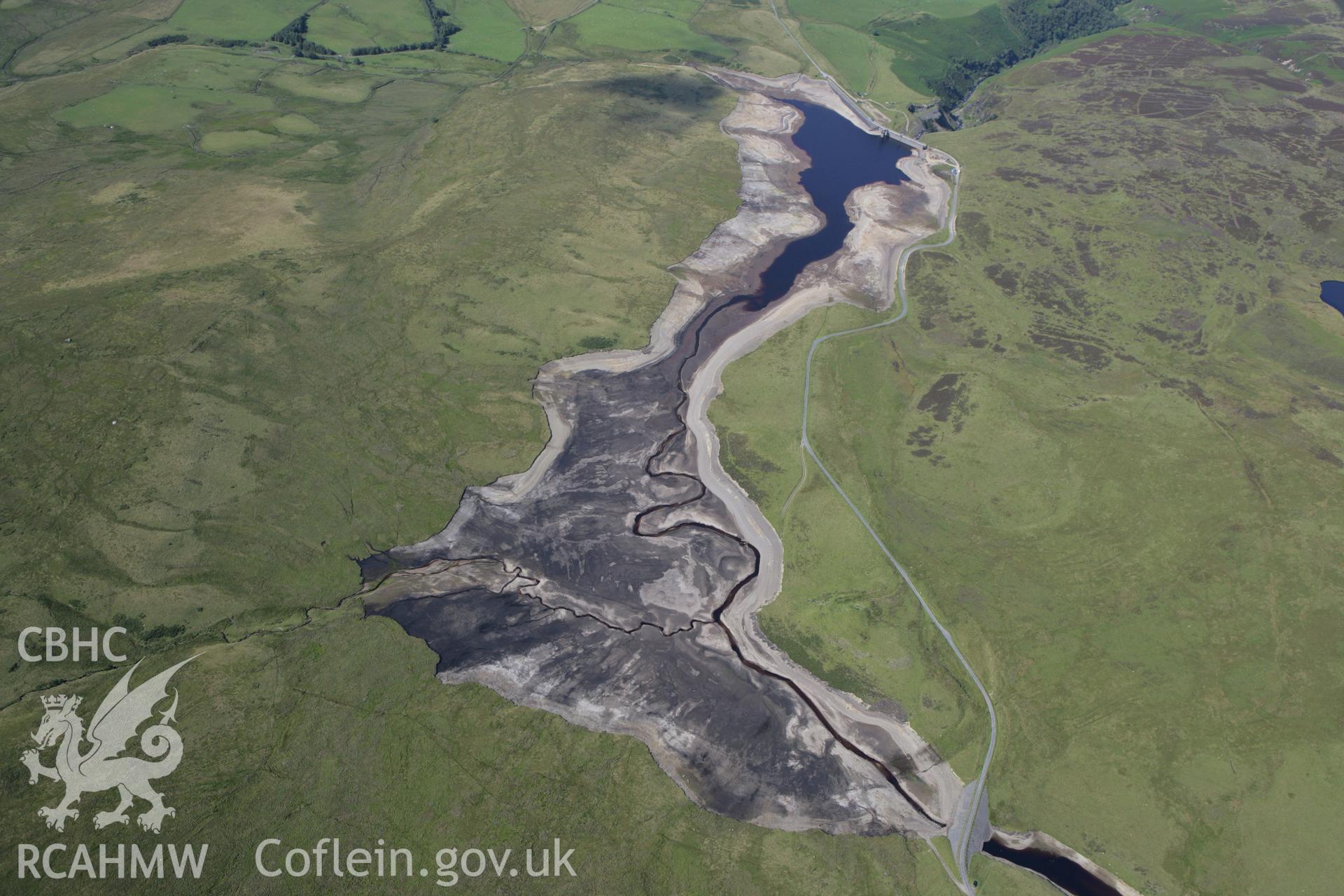 RCAHMW colour oblique aerial photograph showing landscape of Llyn Aled Isaf Mesolithic Occupation Site. Taken on 31 July 2007 by Toby Driver