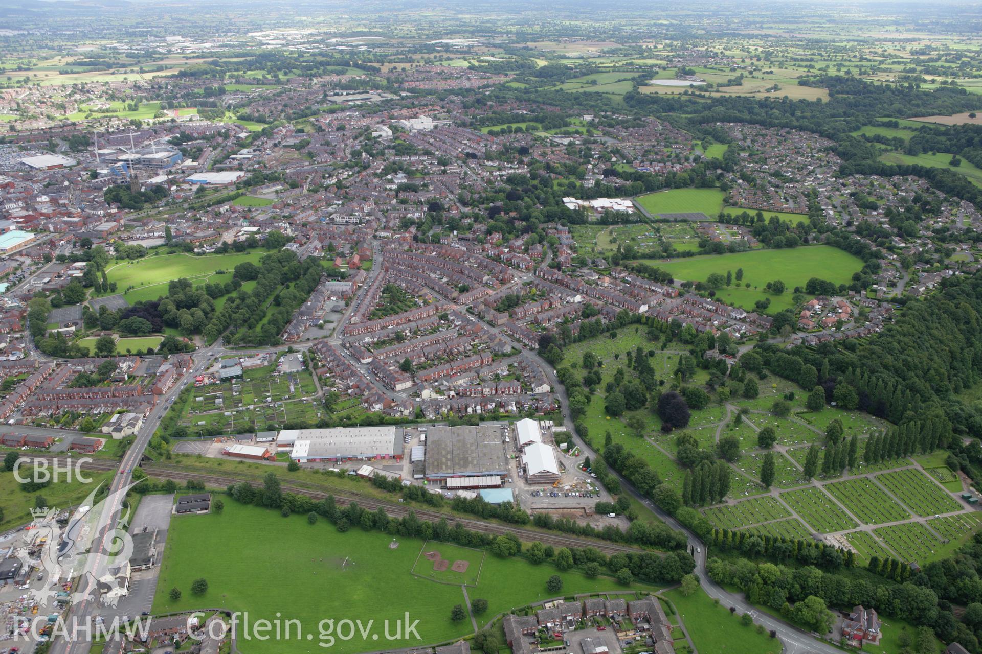 RCAHMW colour oblique aerial photograph of Wrexham showing housing in the southern part of the town. Taken on 24 July 2007 by Toby Driver