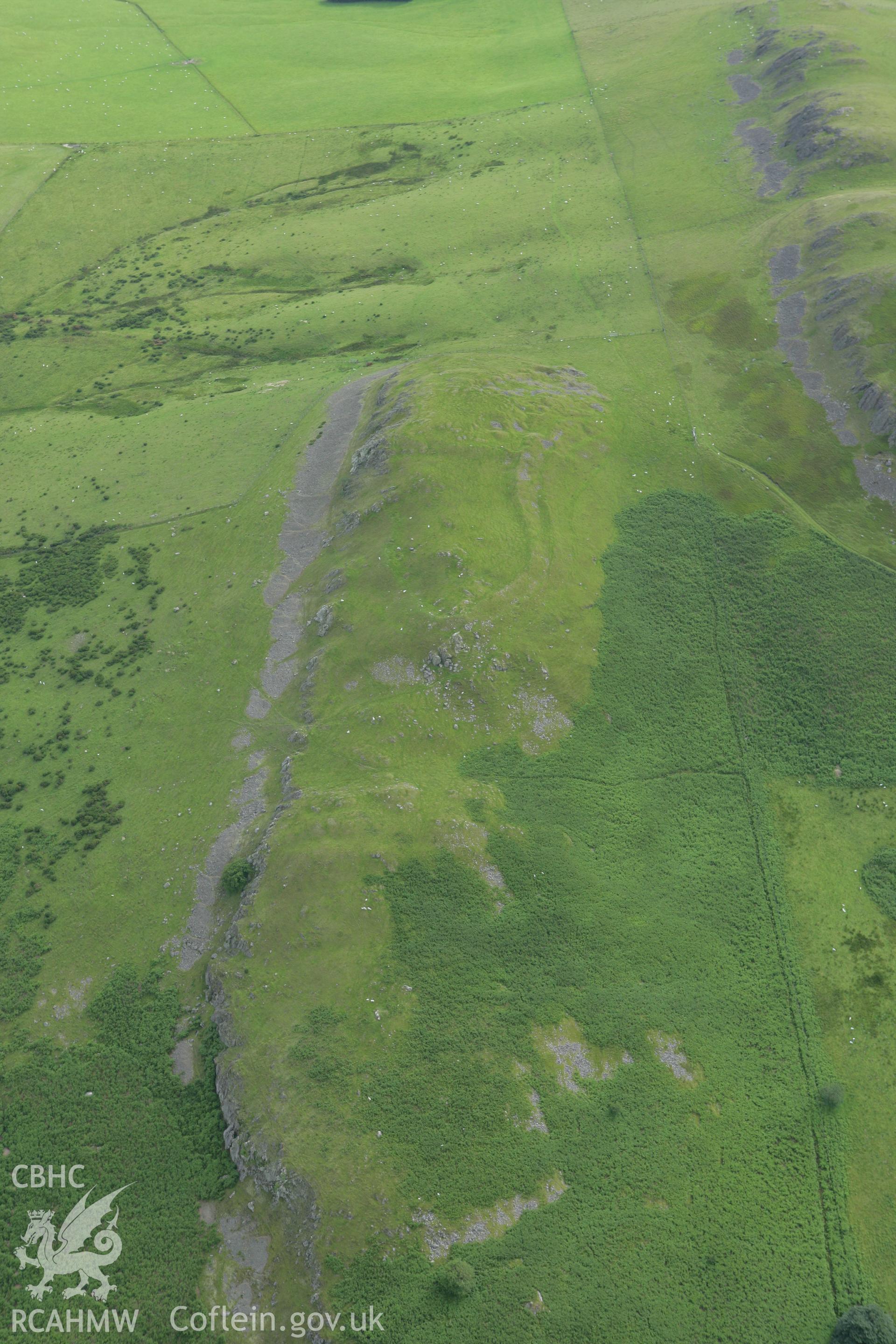 RCAHMW colour oblique aerial photograph of Llandegley Rocks Enclosure. Taken on 09 July 2007 by Toby Driver