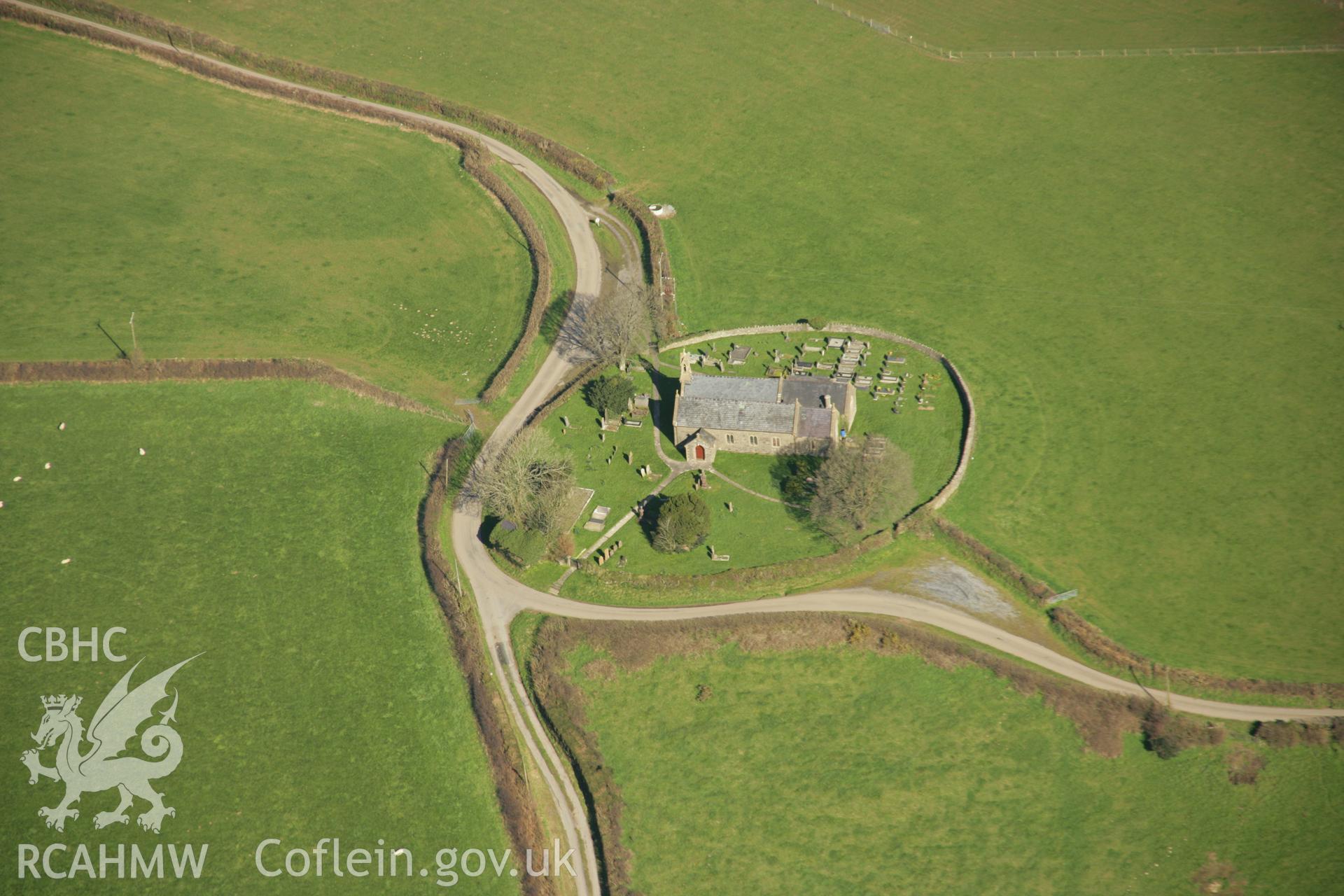 RCAHMW colour oblique aerial photograph showing circular churchyard of St Cynog's Church, Nantego, Llangynog. Taken on 21 March 2007 by Toby Driver
