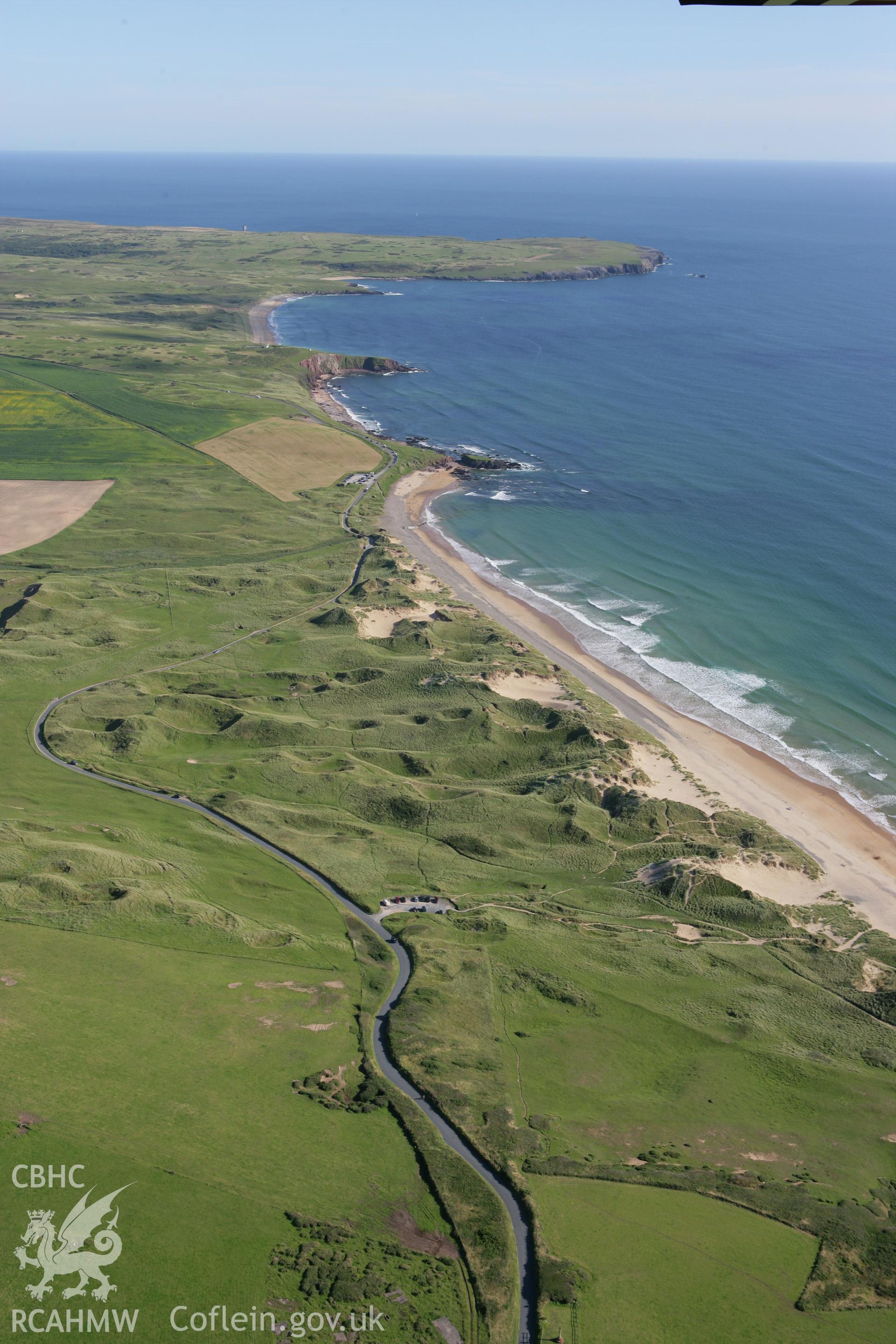 RCAHMW colour oblique aerial photograph of a seaweed drying shed in landscape view of Freshwater West. Taken on 30 July 2007 by Toby Driver