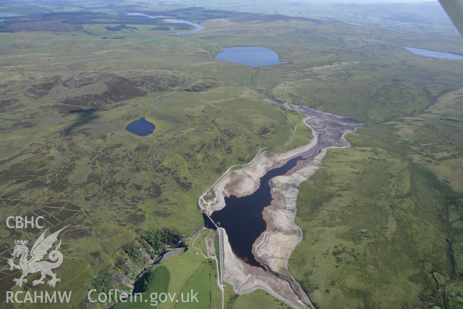 RCAHMW colour oblique aerial photograph showing landscape of Llyn Aled Isaf Mesolithic Occupation Site. Taken on 31 July 2007 by Toby Driver