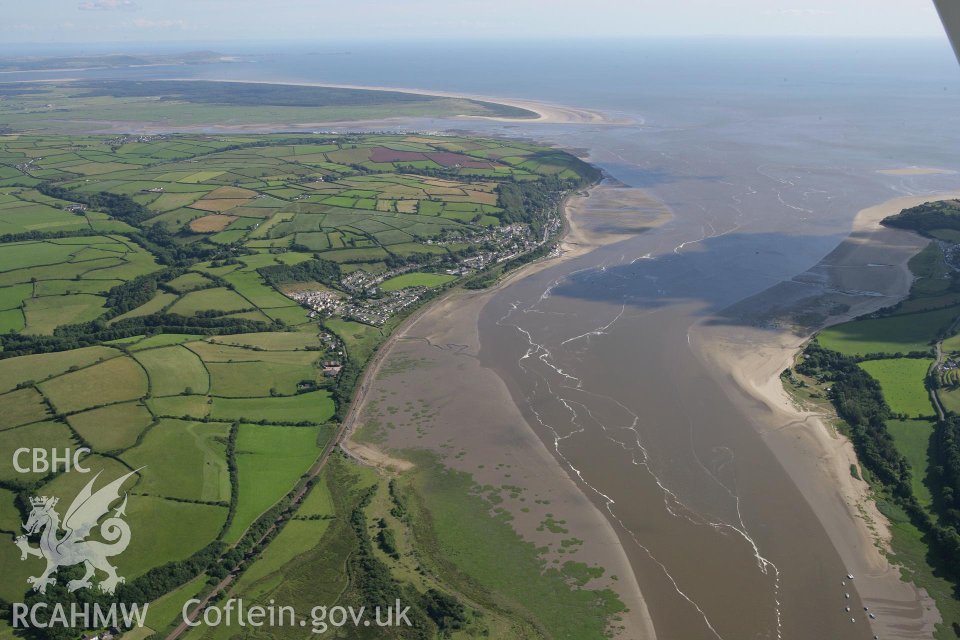 RCAHMW colour oblique aerial photograph of Ferryside from the north. Taken on 30 July 2007 by Toby Driver