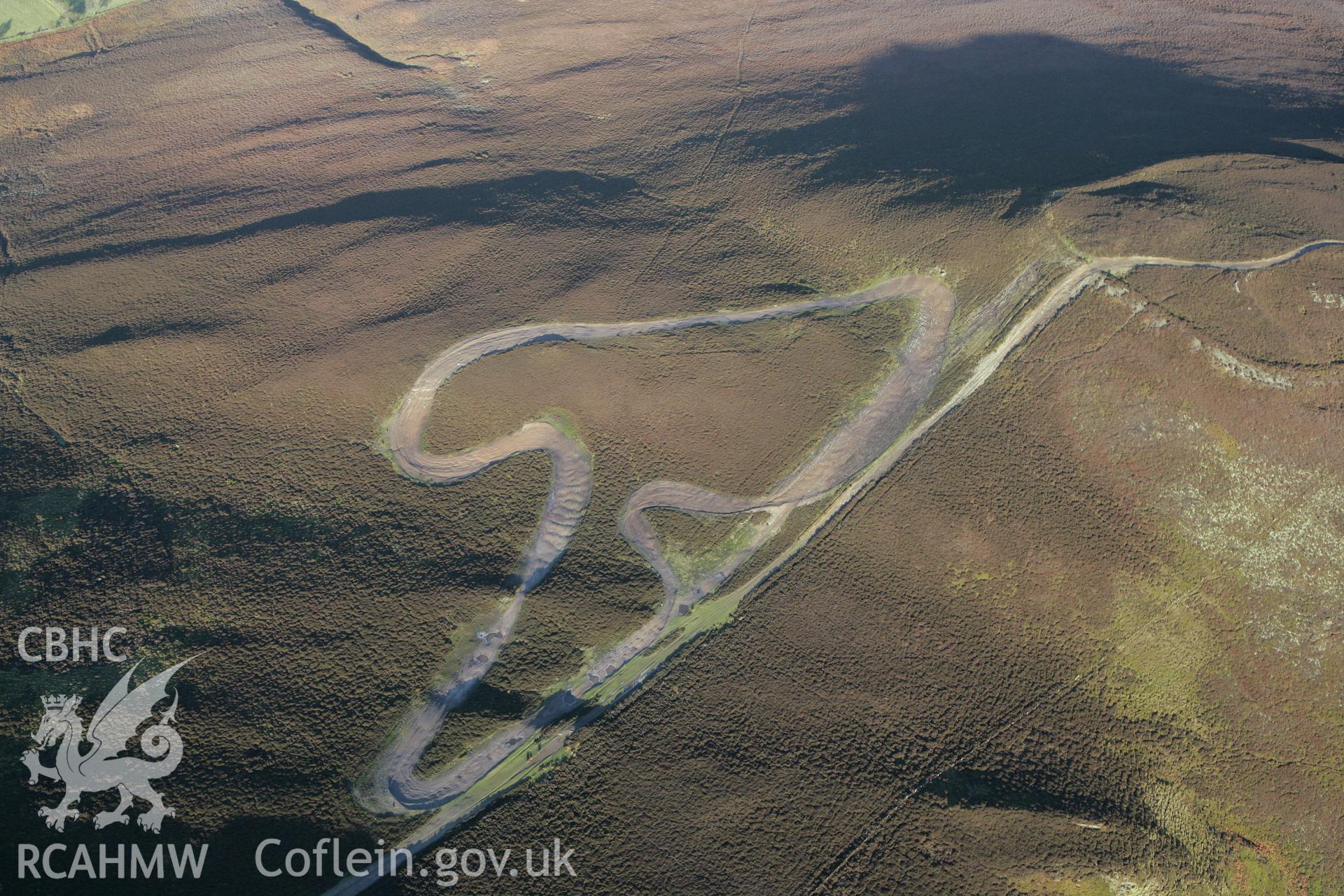 RCAHMW colour oblique photograph of Moel y Gaer hillfort, bike tracks. Taken by Toby Driver on 11/12/2007.