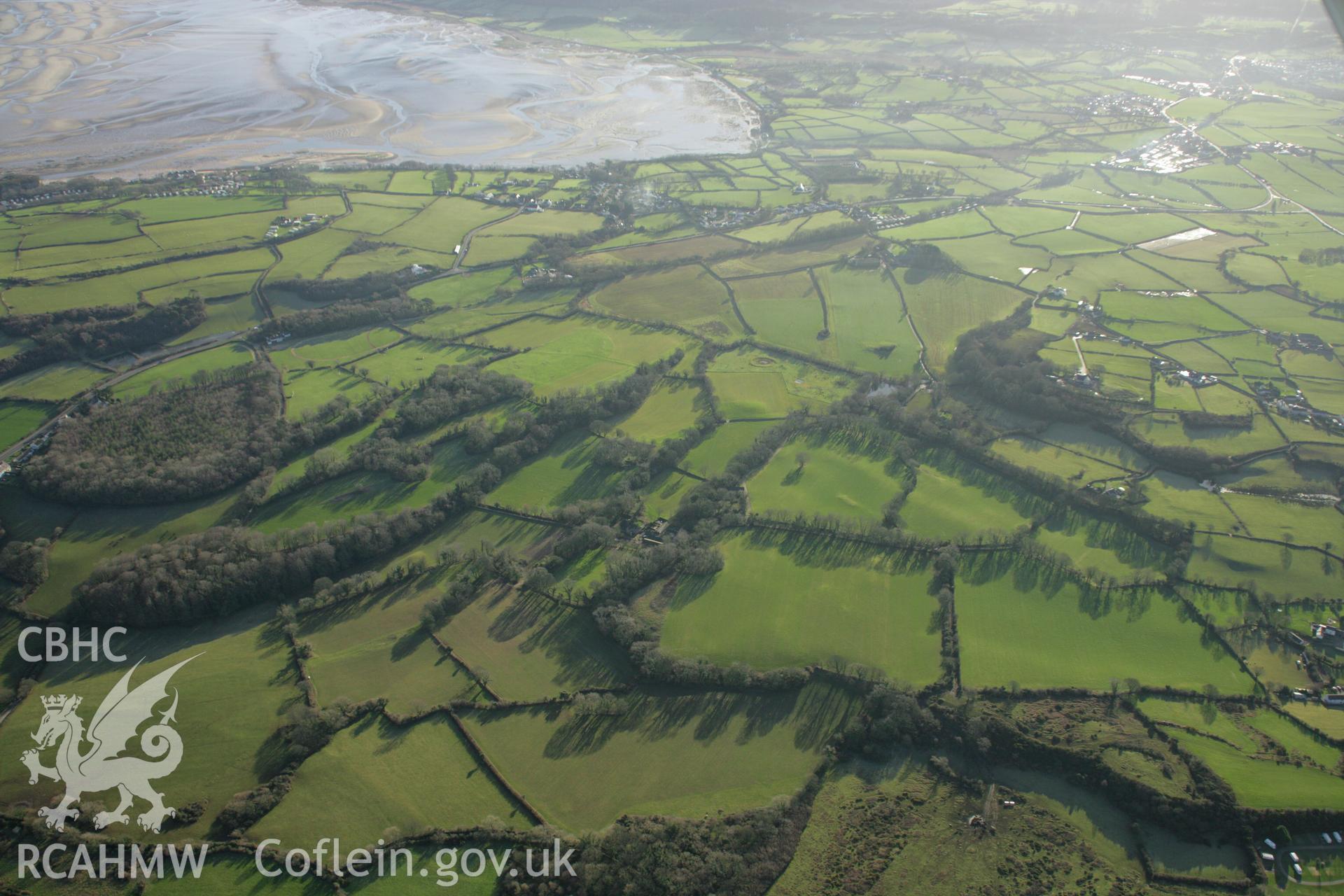 RCAHMW colour oblique aerial photograph of the Viking settlement at Glyn, Llanbedrgoch. Taken on 25 January 2007 by Toby Driver